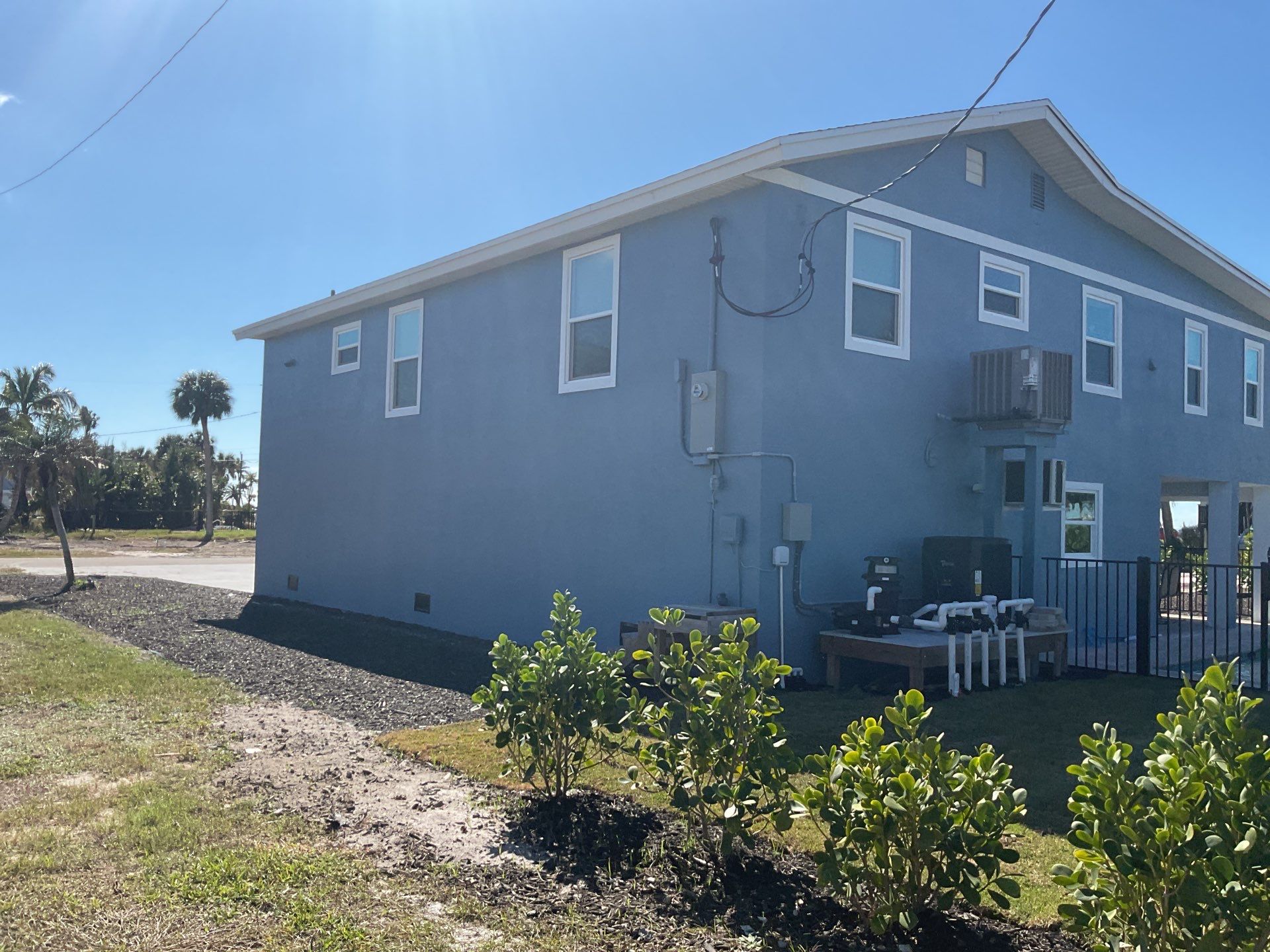 Downspout Installation for Two-Story Home in Fort Myers FL by Gutter Professor by Gutter Professors