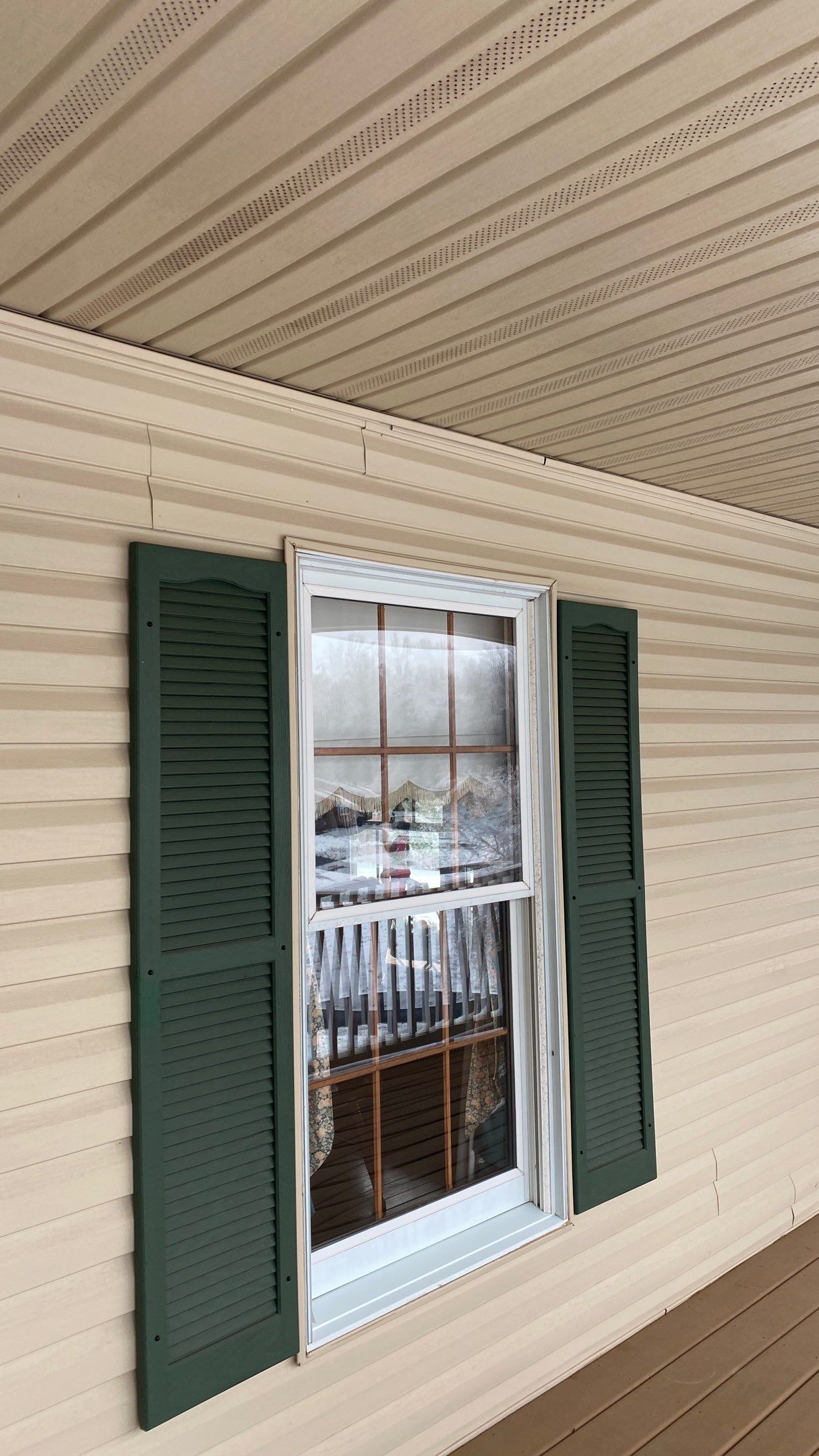 Exterior remodel including window replacement by American Home Contractors