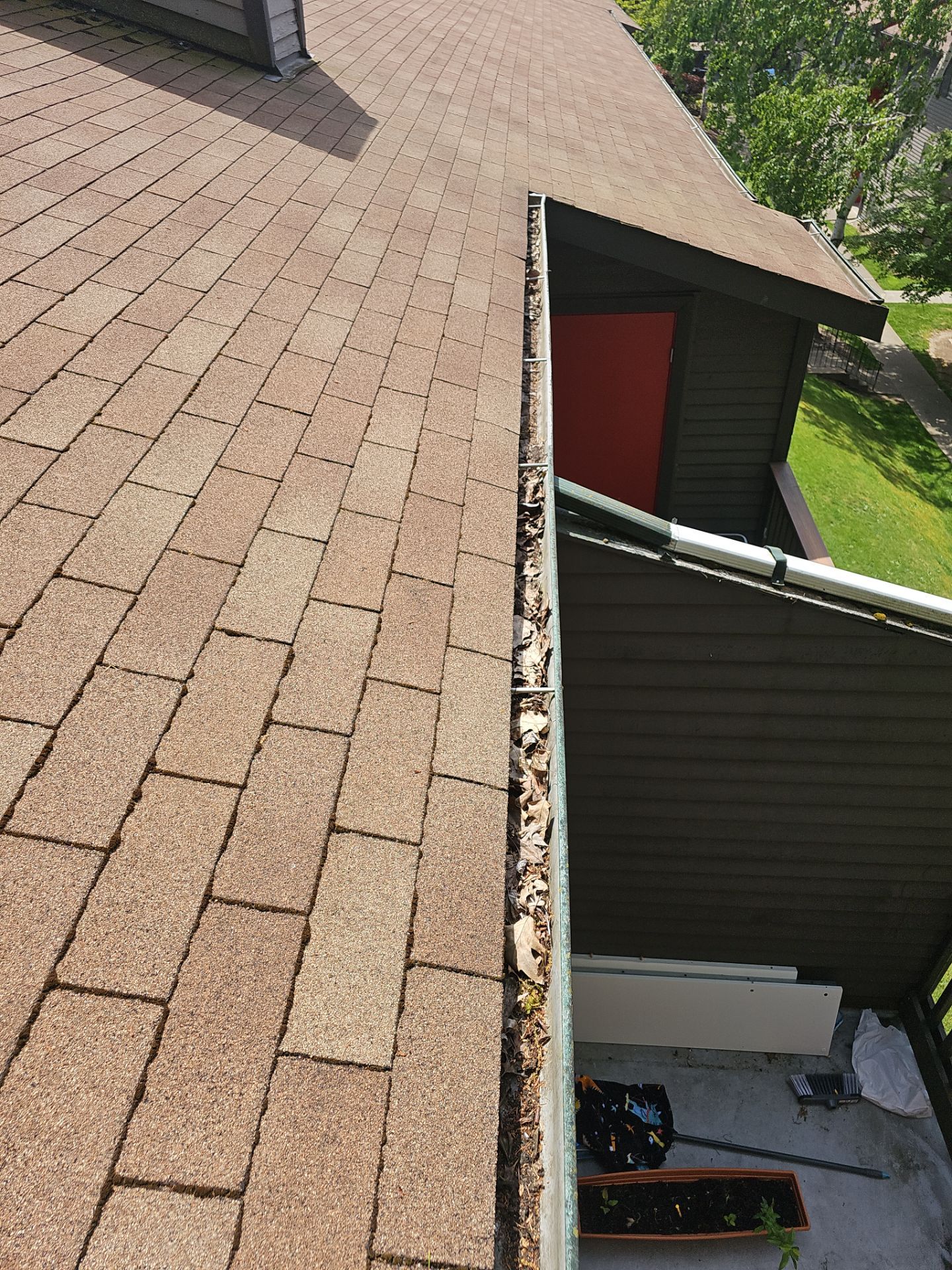 Commercial gutter cleaning Edgewood, WA before photo with filled gutters