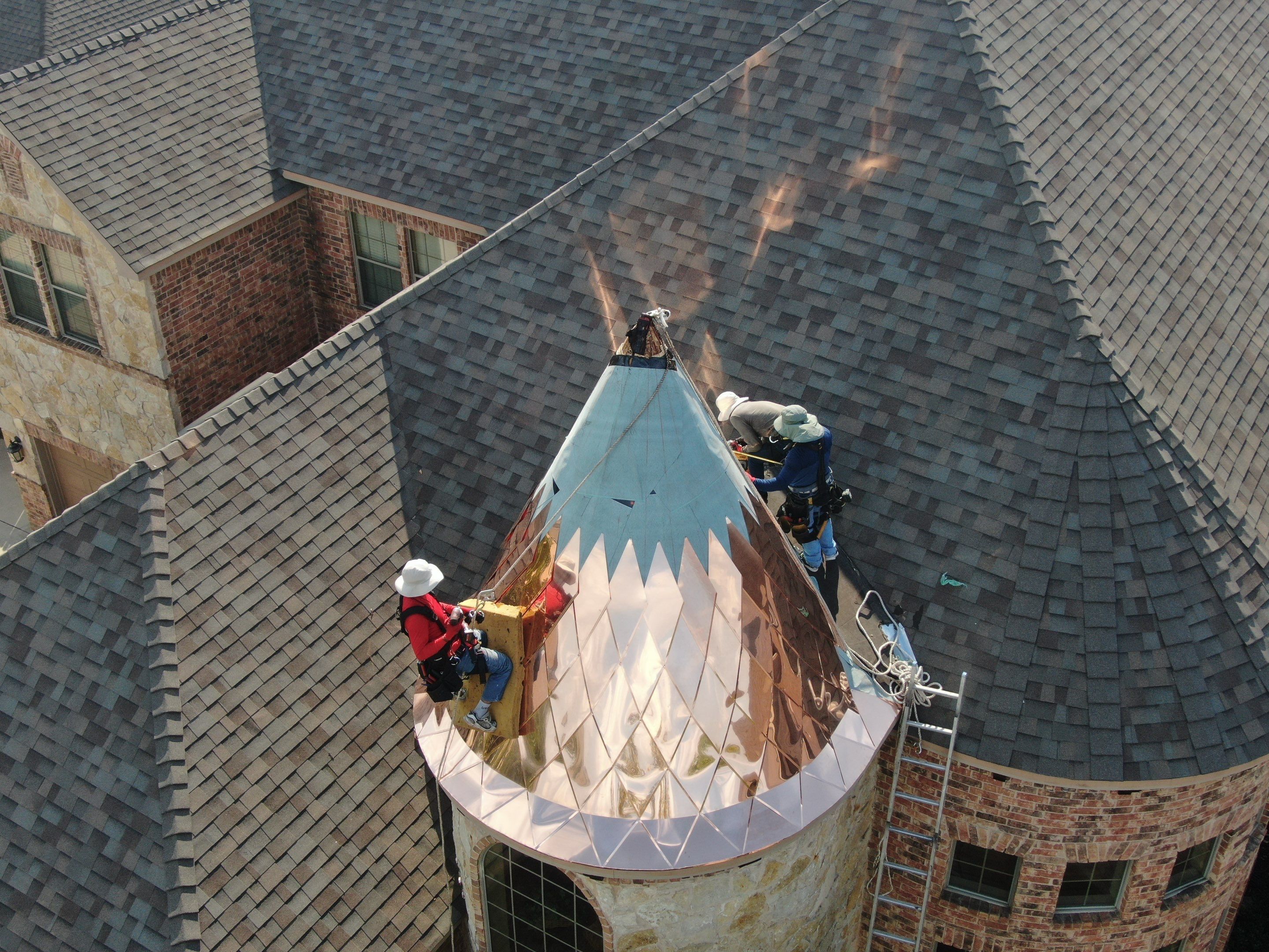 Installing Custom copper turret and Malarkey Vista Class 4 shingles Hail Damage Upgrade by Becker Roofing and Exteriors