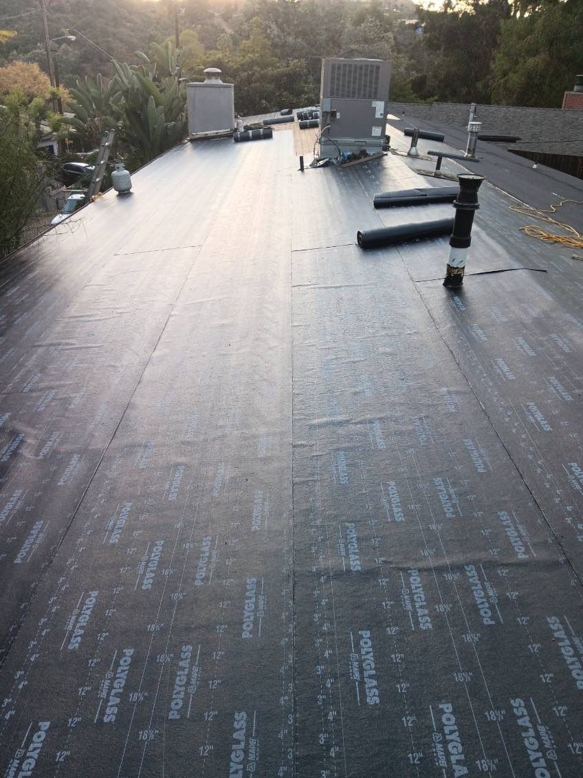Residential Roofing Installation using Polyfresko® G Highly Reflective Modified Bitumen Cap Sheet by Hull Brothers Roofing