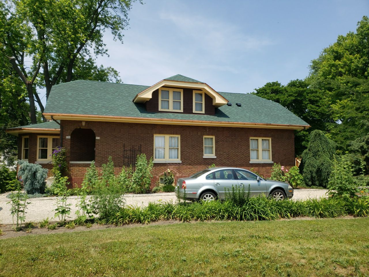 Asphalt Shingle Replacement and Half Round Copper Gutters Installation by Custom Installations, Inc.