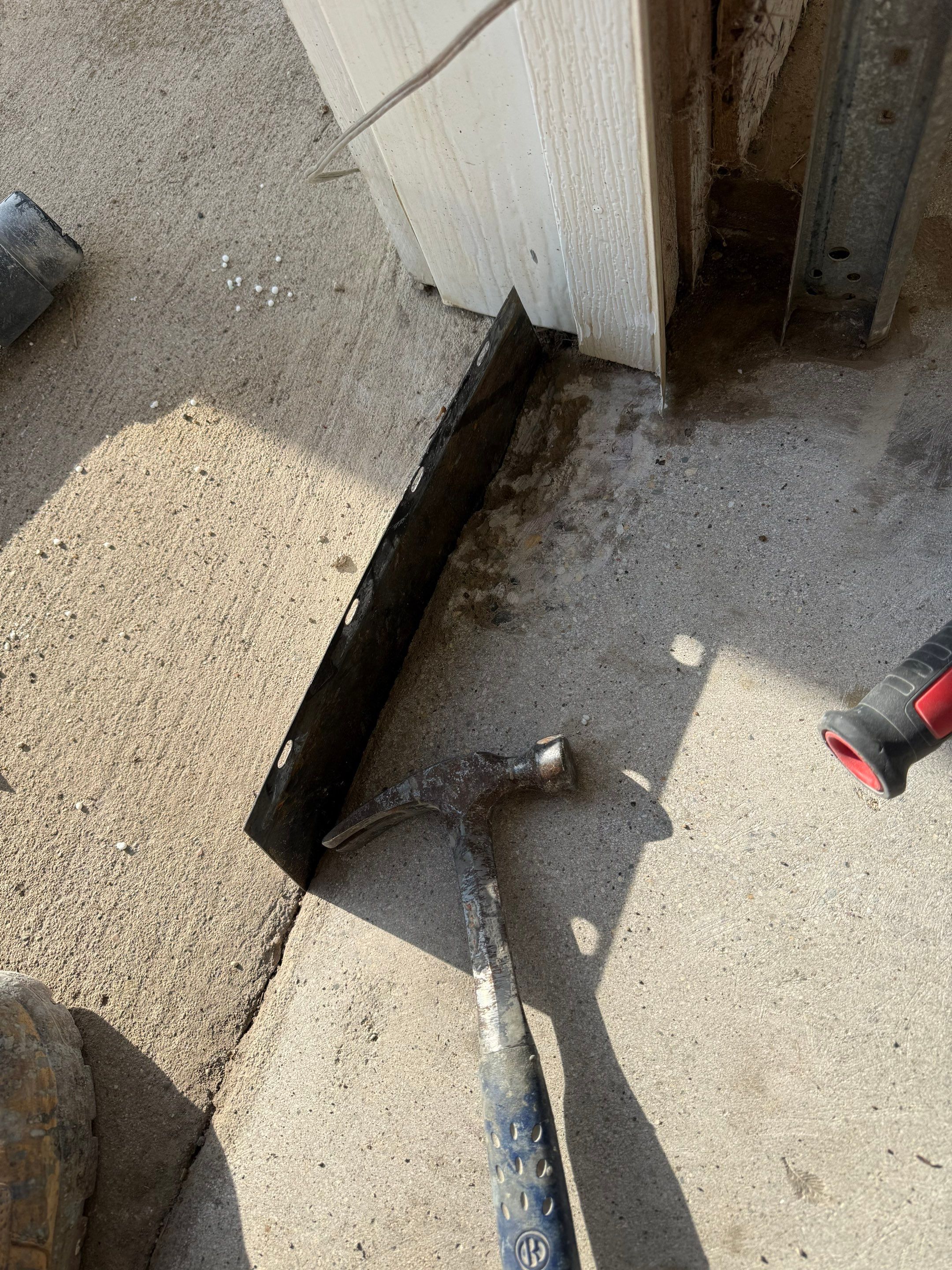 Feather Grey Garage Floor Coating and Crack Repair in Beresford by Select Painting, Coatings & Garage Cabinets