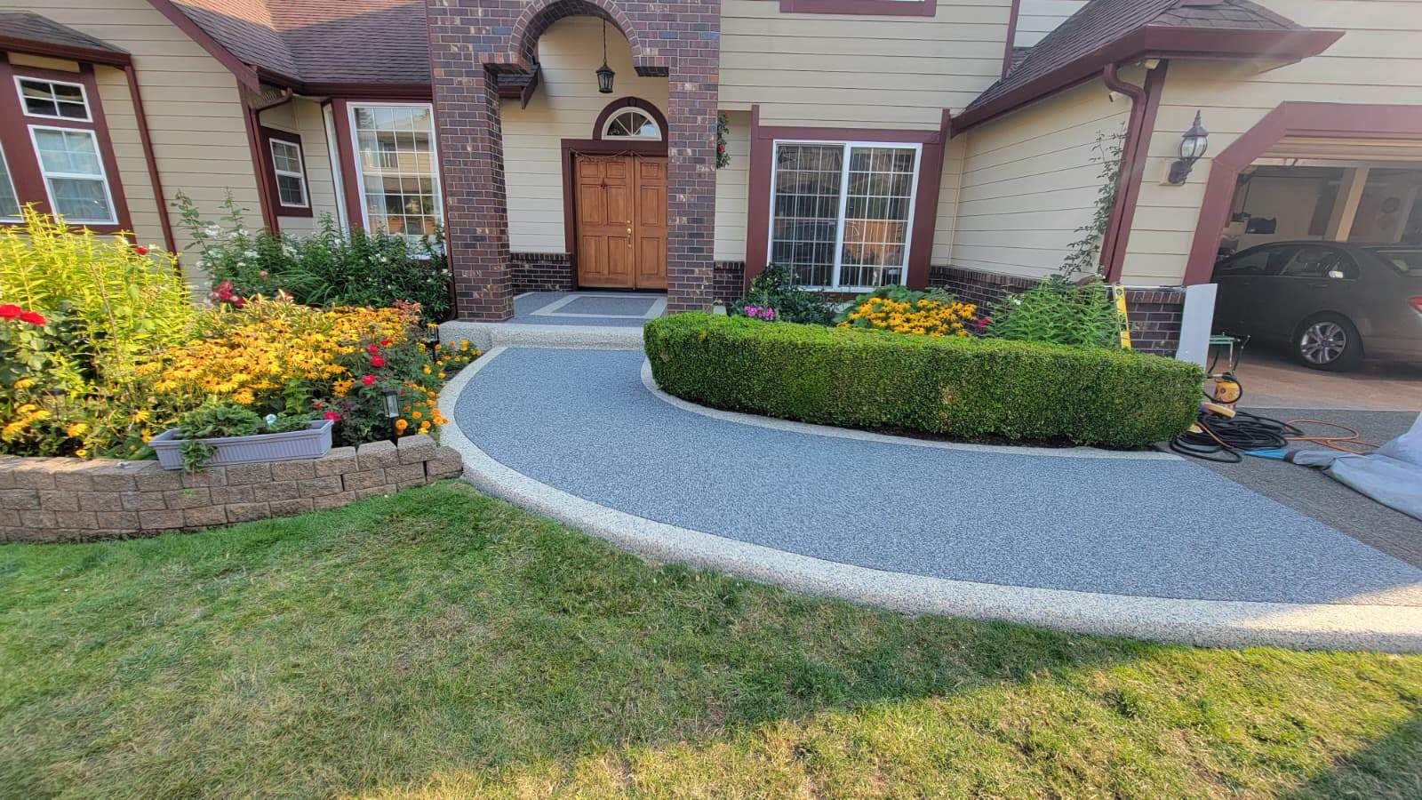 Elegant Walkway and Patio in Palazzo and Santorini Vuba Stone by Concrete Coating Experts Inc.