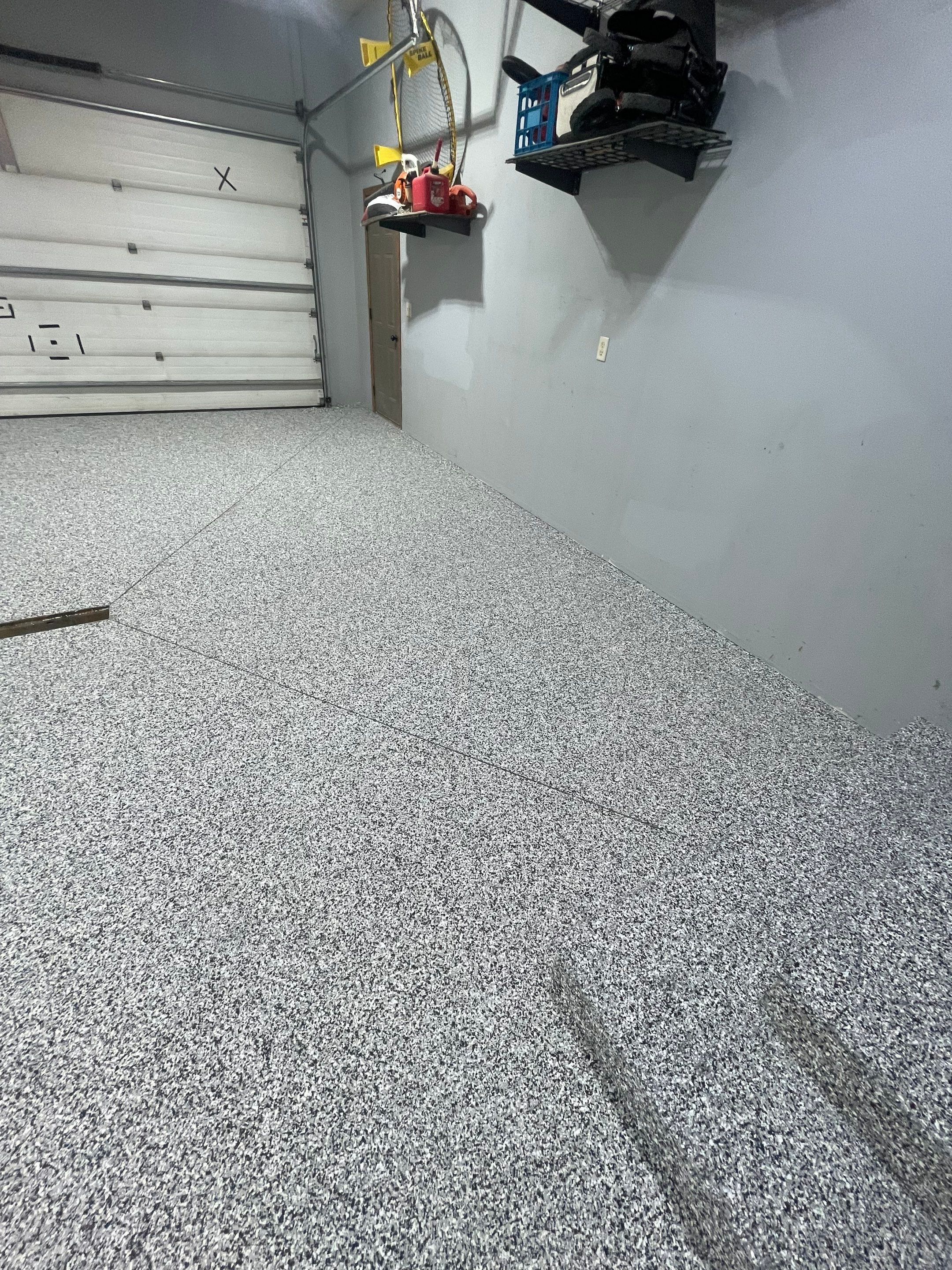 Full Garage Floor Epoxy Coating Installation in Dell Rapids by Select Painting, Coatings & Garage Cabinets