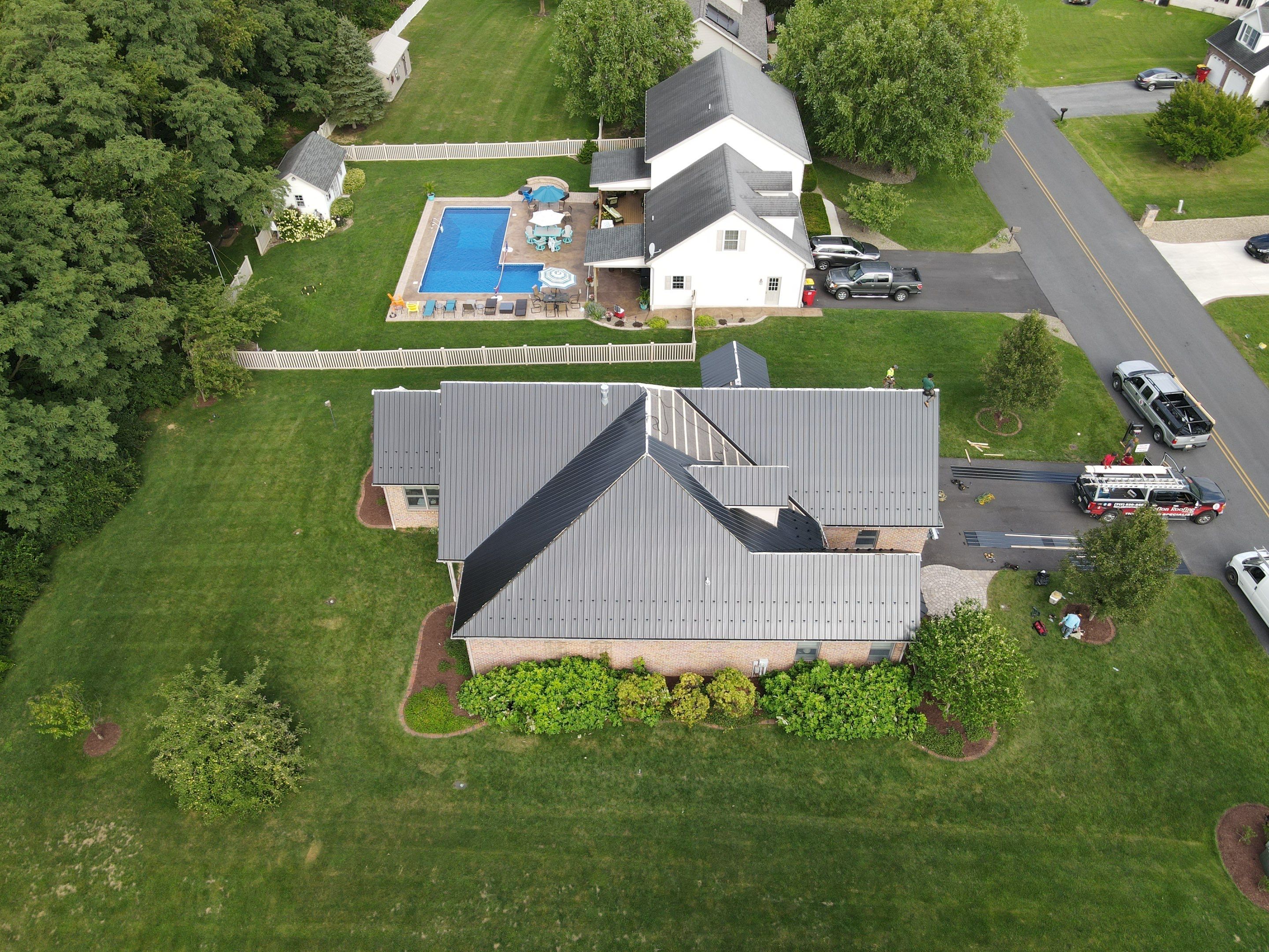 Standing seam / Azm panel in black  by Teflon Roofing