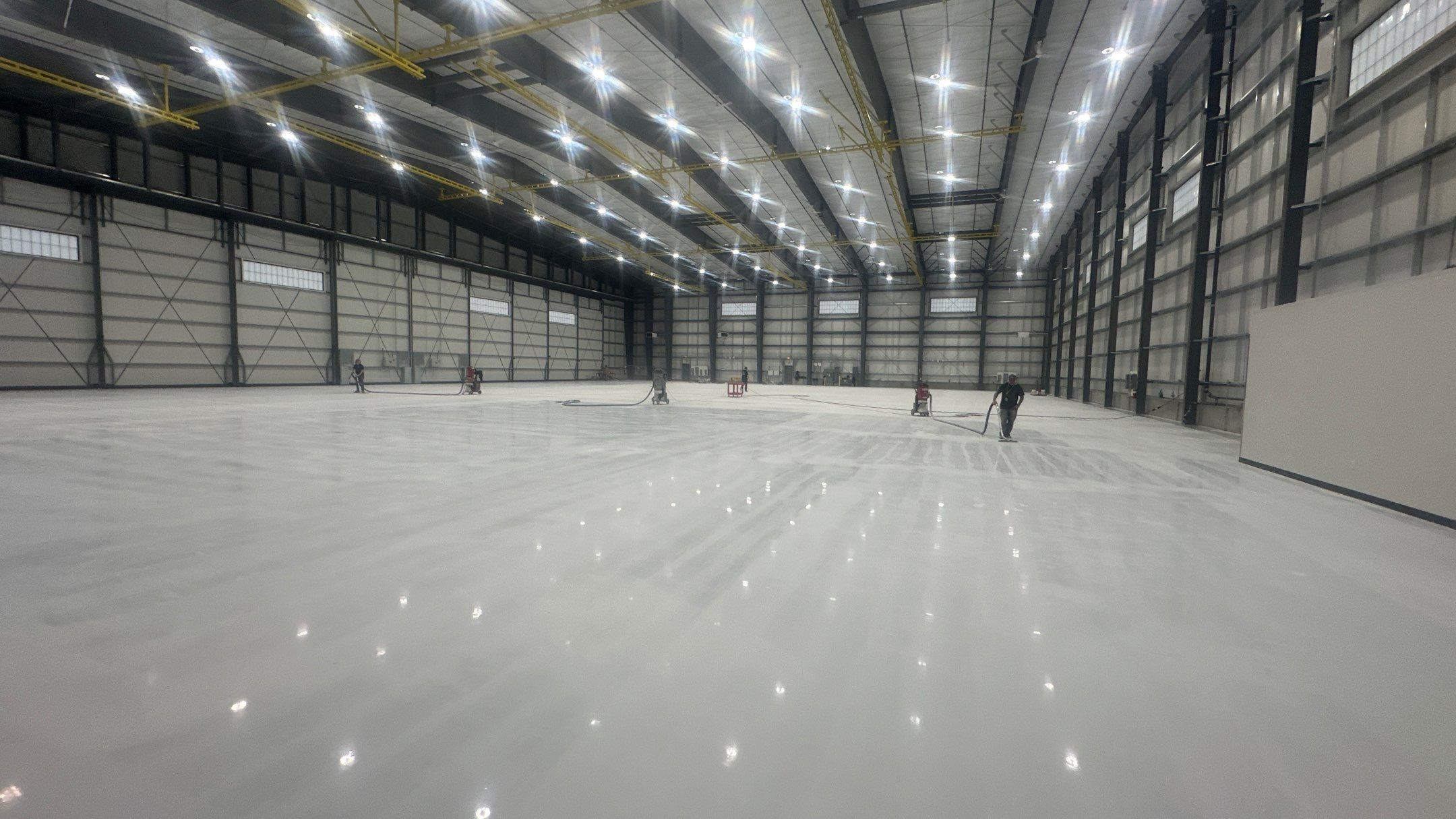 Airplane Hanger using Light Grey Commercial Penntek Epoxy by Croc Coatings, LLC