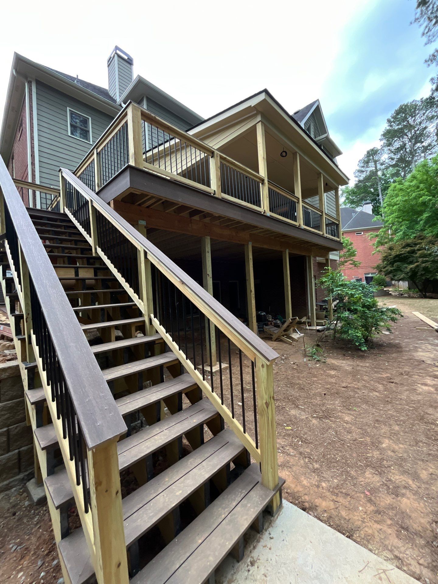 Tucker, GA Covered Porch Build and Deck Replacement using Deckorators Voyage Series Decking by Nelson Exteriors 