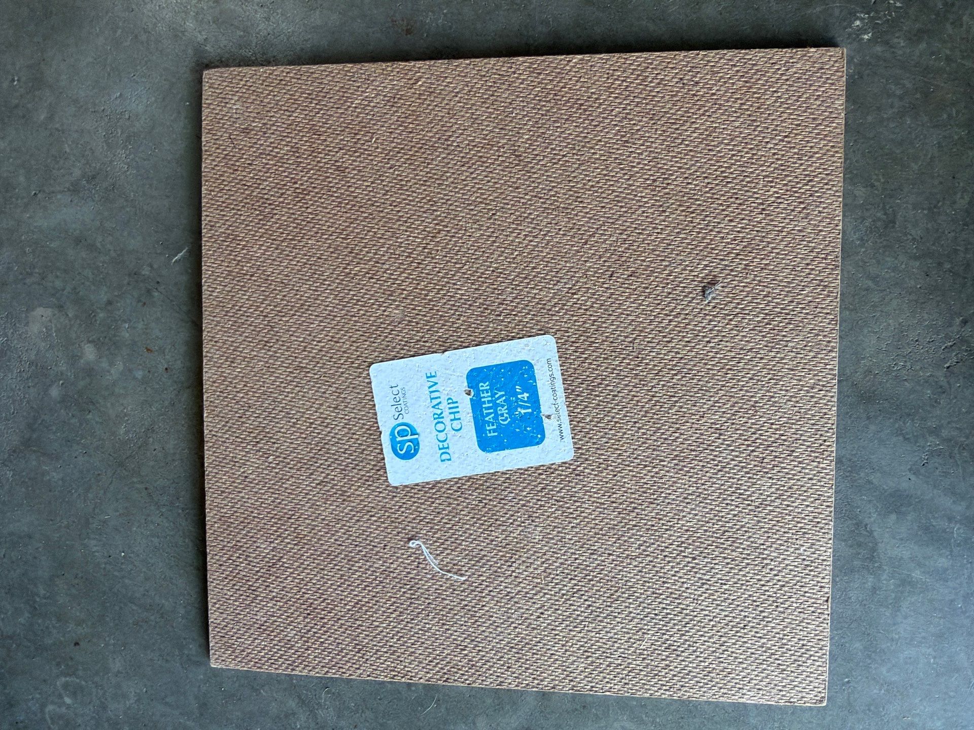 Residential Garage Floor Coating with Feather Grey Finish in Sioux Falls by Select Painting, Coatings & Garage Cabinets