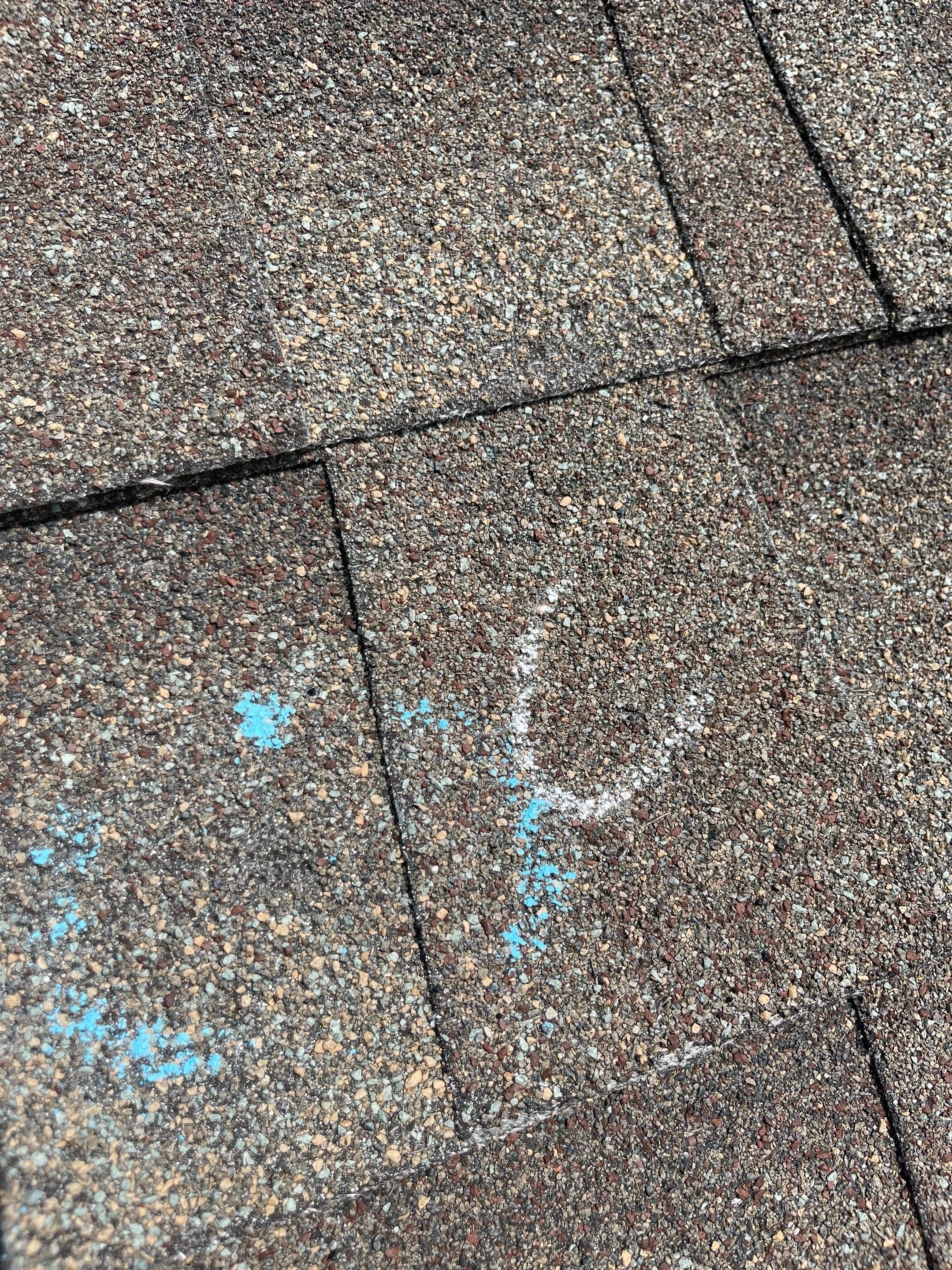 Hail Damage on a Roofing System by Icon Roofing And Construction 