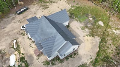 Custom New Construction Home Featuring Standing Seam Metal Roofing in Port Haywood