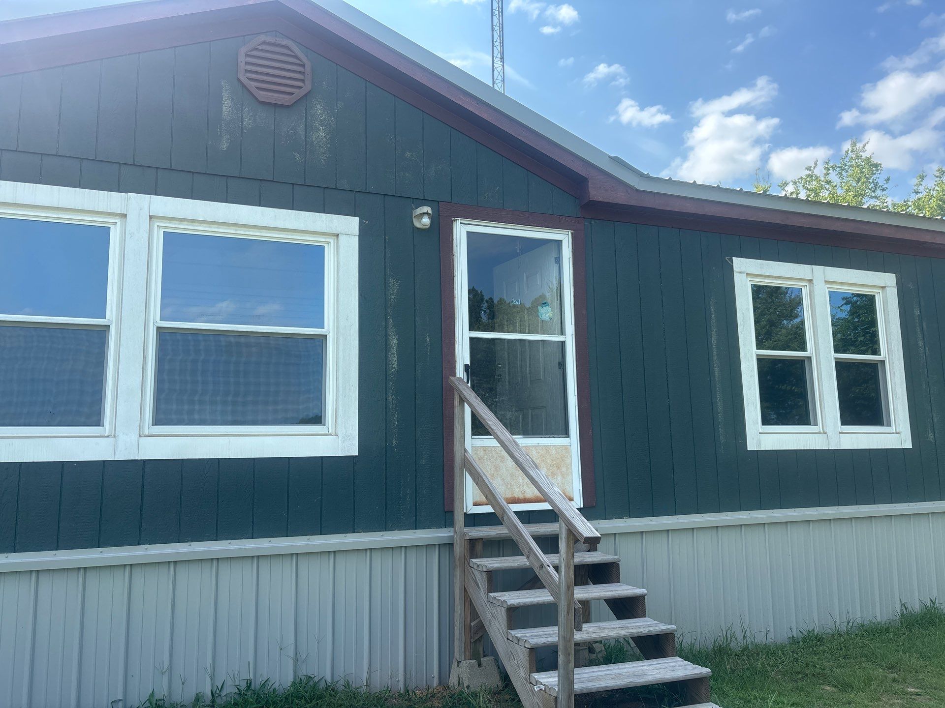 Exterior Painting in Fruitvale, TX | Wood Porch & Home in Deep Navy Blue by Quality Coats Painting