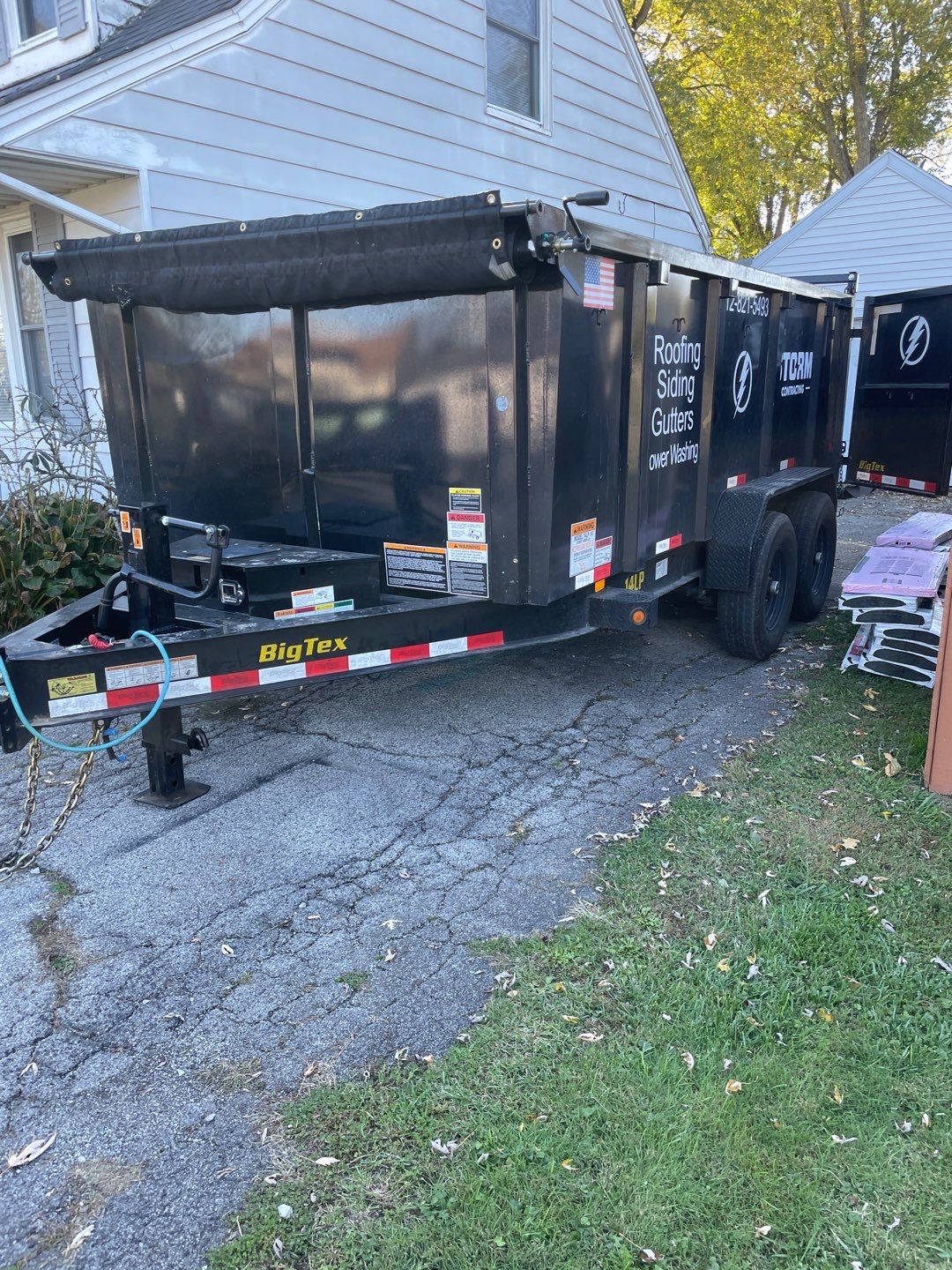 Residential Roofing Installation using Tamko Titan and aluminum siding repair by Storm Contracting 