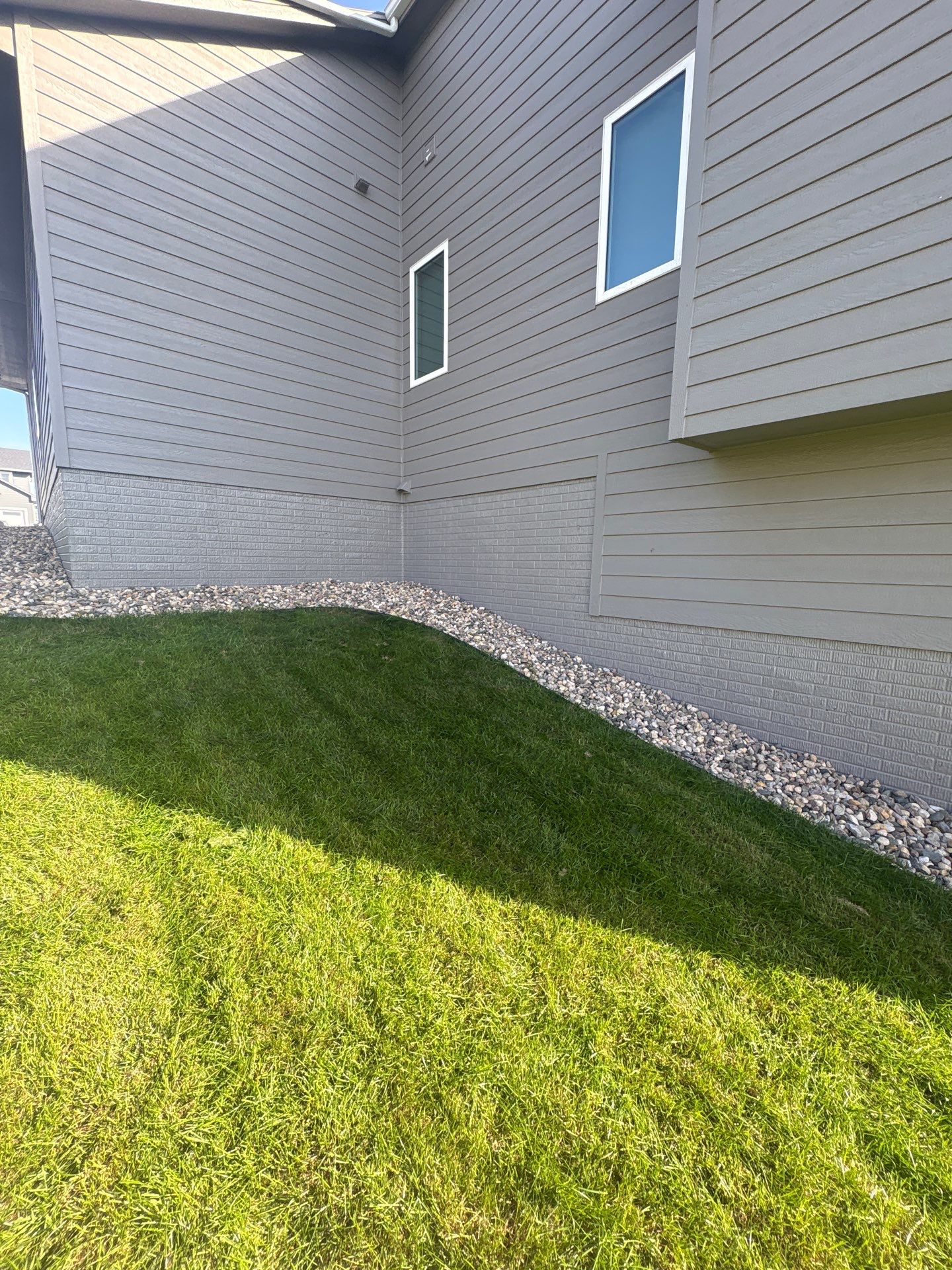 Gray Foundation Painting and Exterior Surface Refresh in Sioux Falls by Select Painting, Coatings & Garage Cabinets