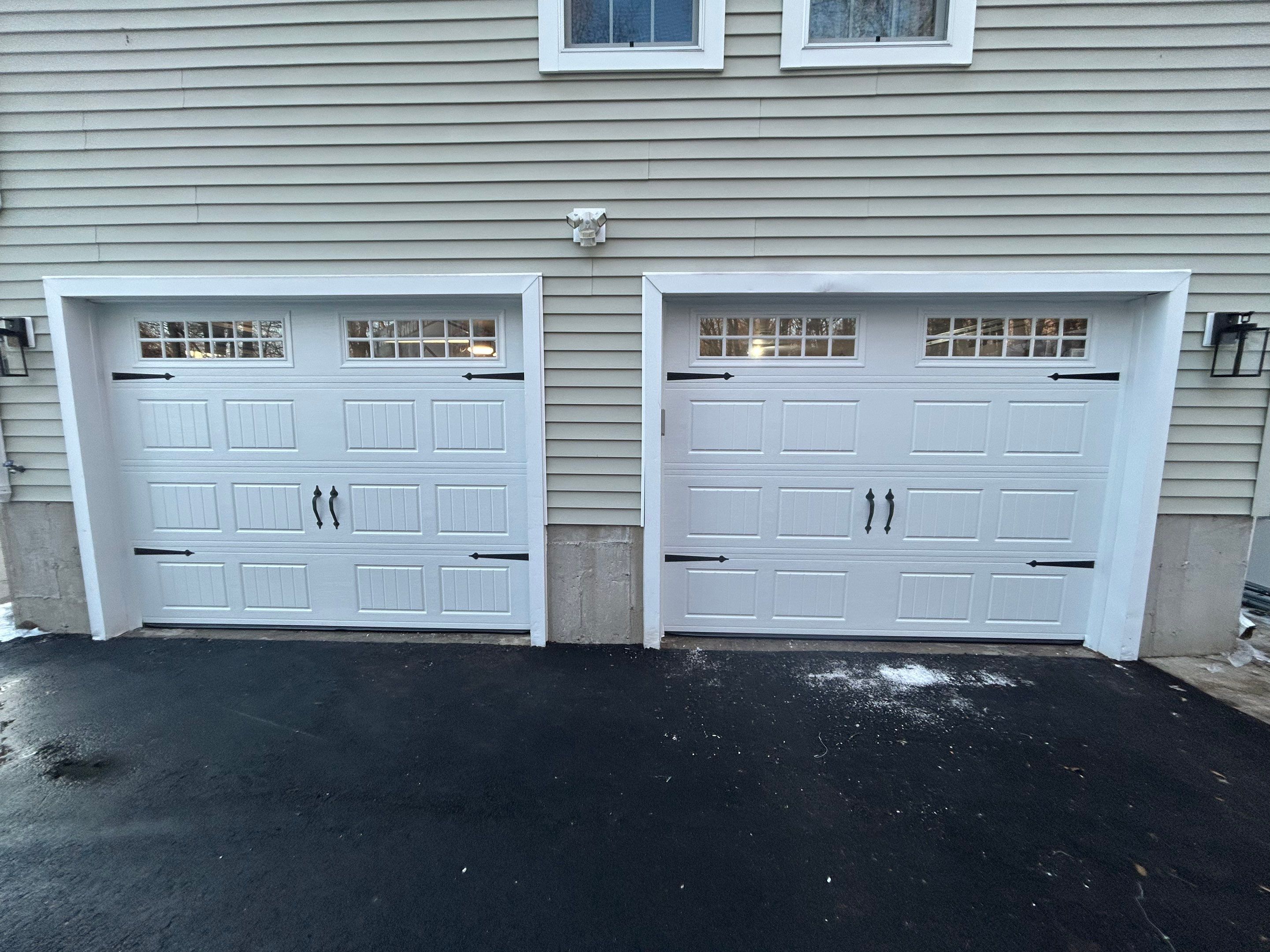 Garage Door Upgrade with Added Light & Detail by DiGiorgi Roofing and Siding Inc