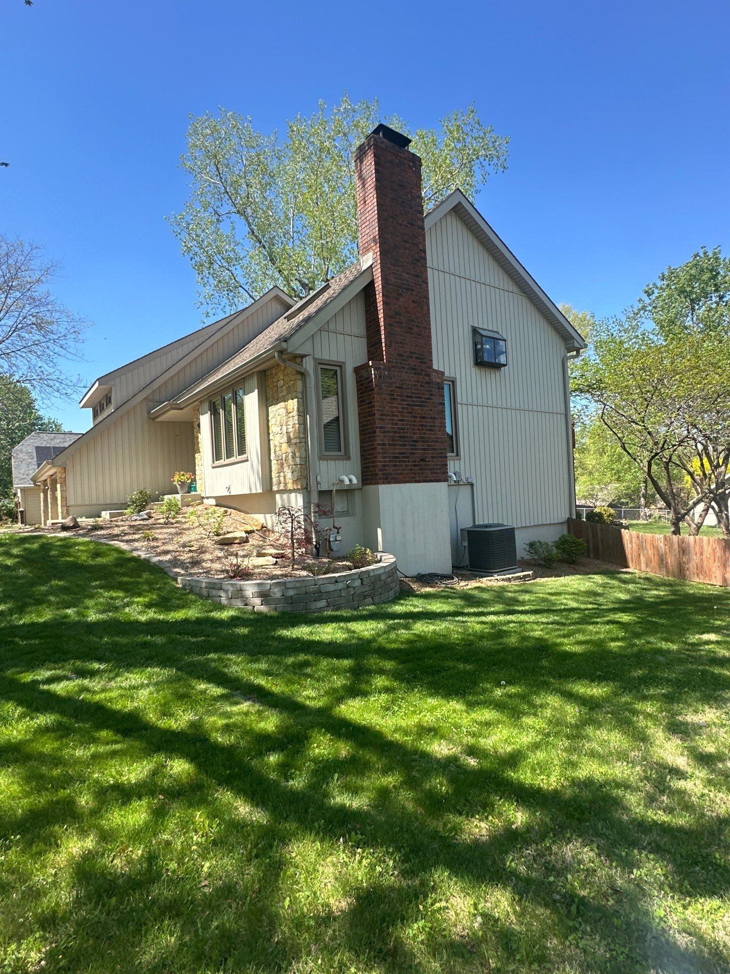 Comprehensive Kansas City Exterior Remodel Featuring Board And Batten Siding by EEC Windows, Siding & Roofing