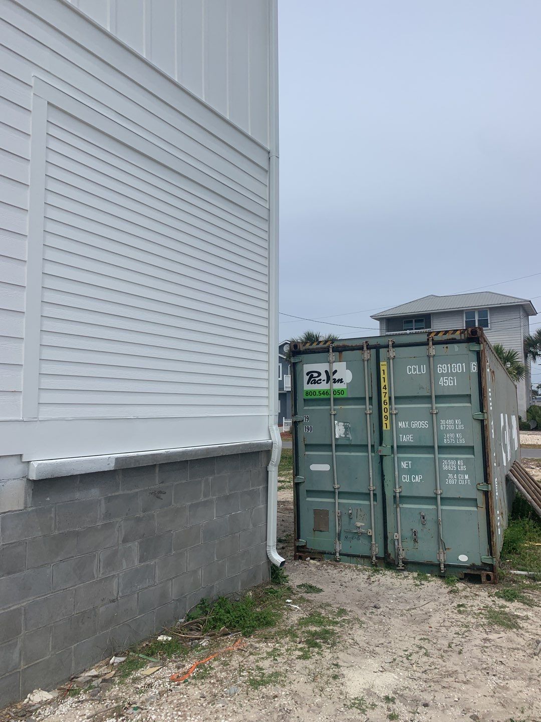 Downspout Installation for Multi-Story Building in Panama City FL by Gutter Professors