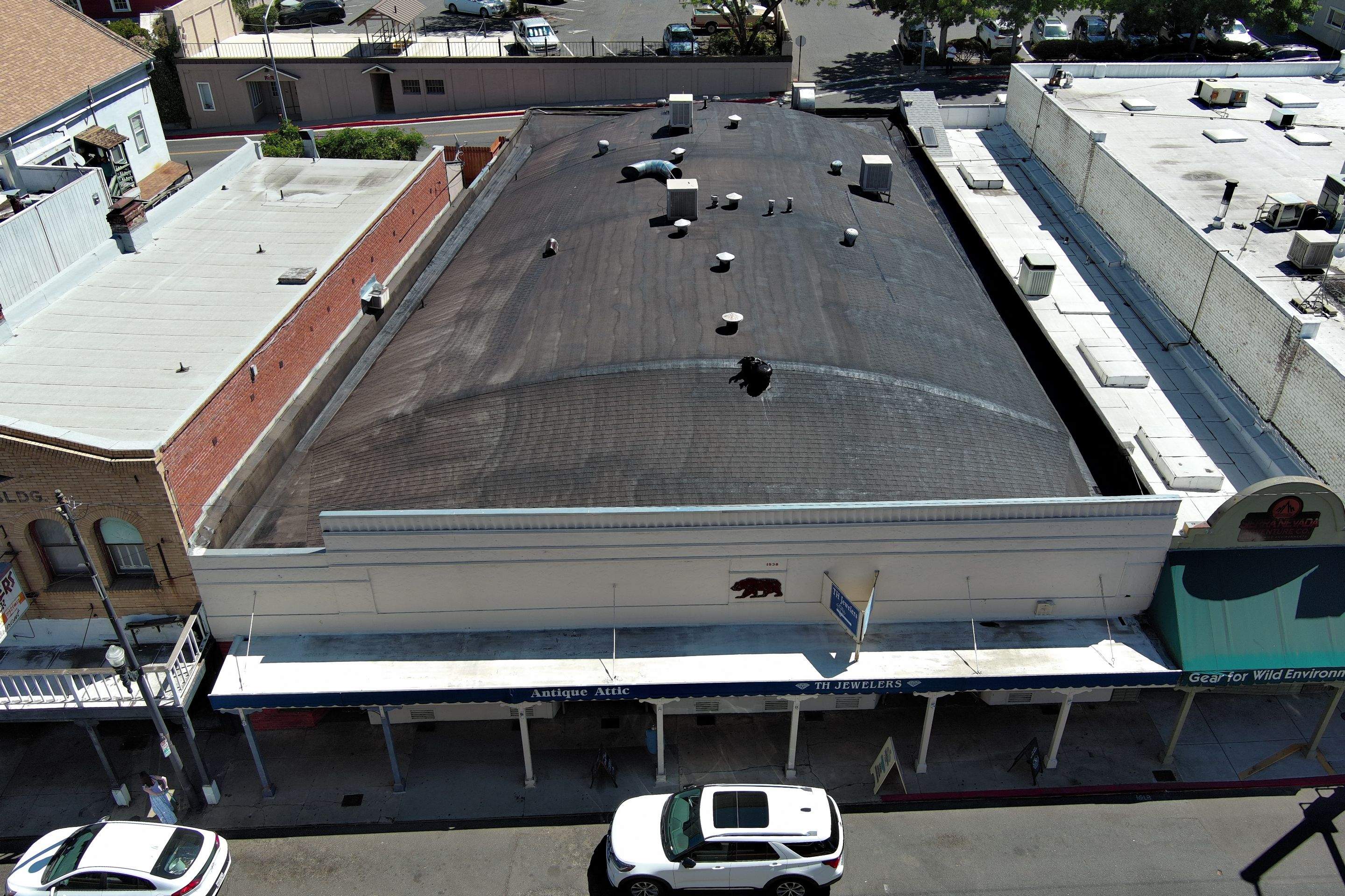 Foam and coatings on commercial roof by Straight Edge Roofing Inc