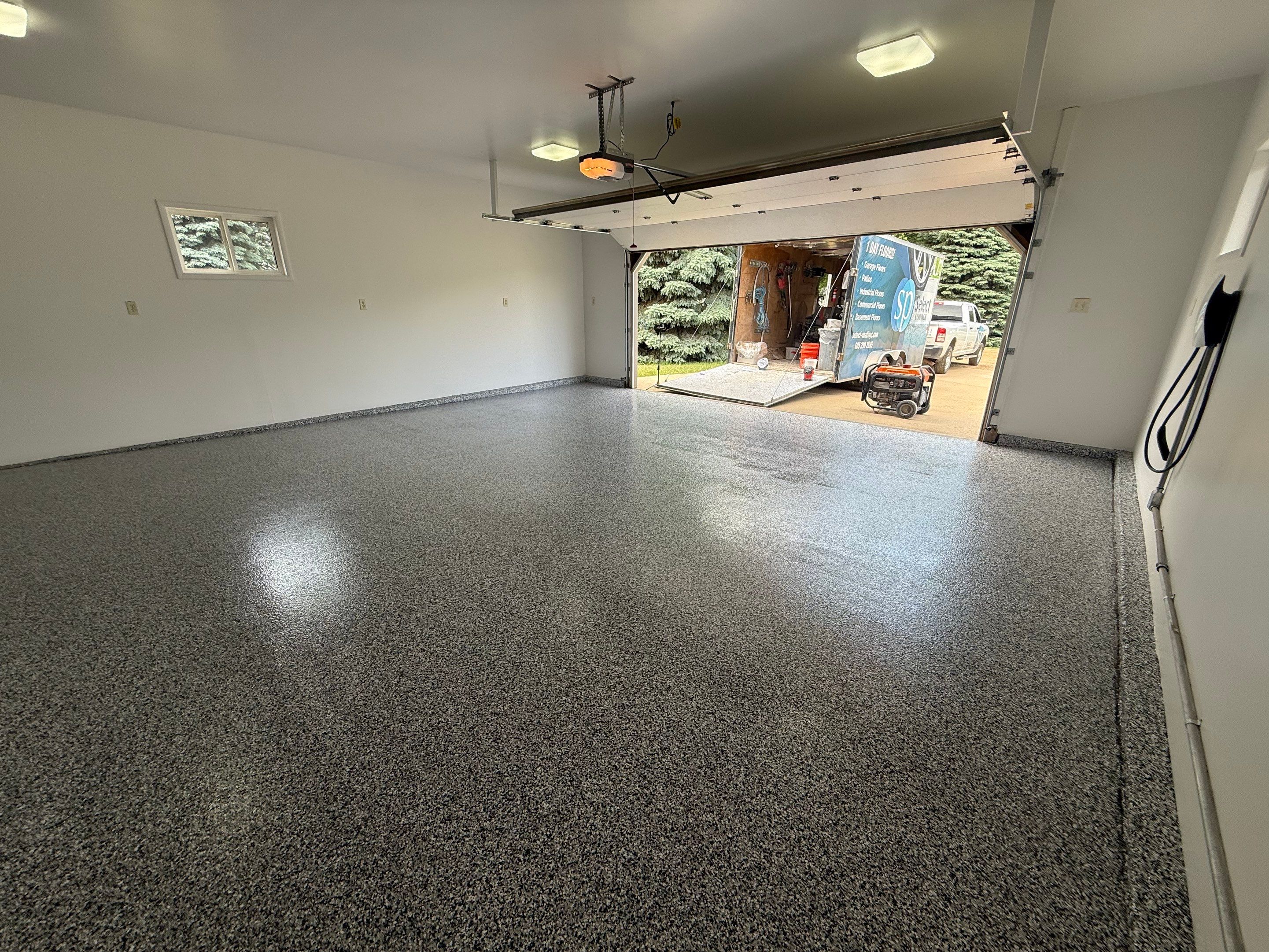 Full Garage Floor and Basement Stair Epoxy Coating in Sioux Falls by Select Painting, Coatings & Garage Cabinets