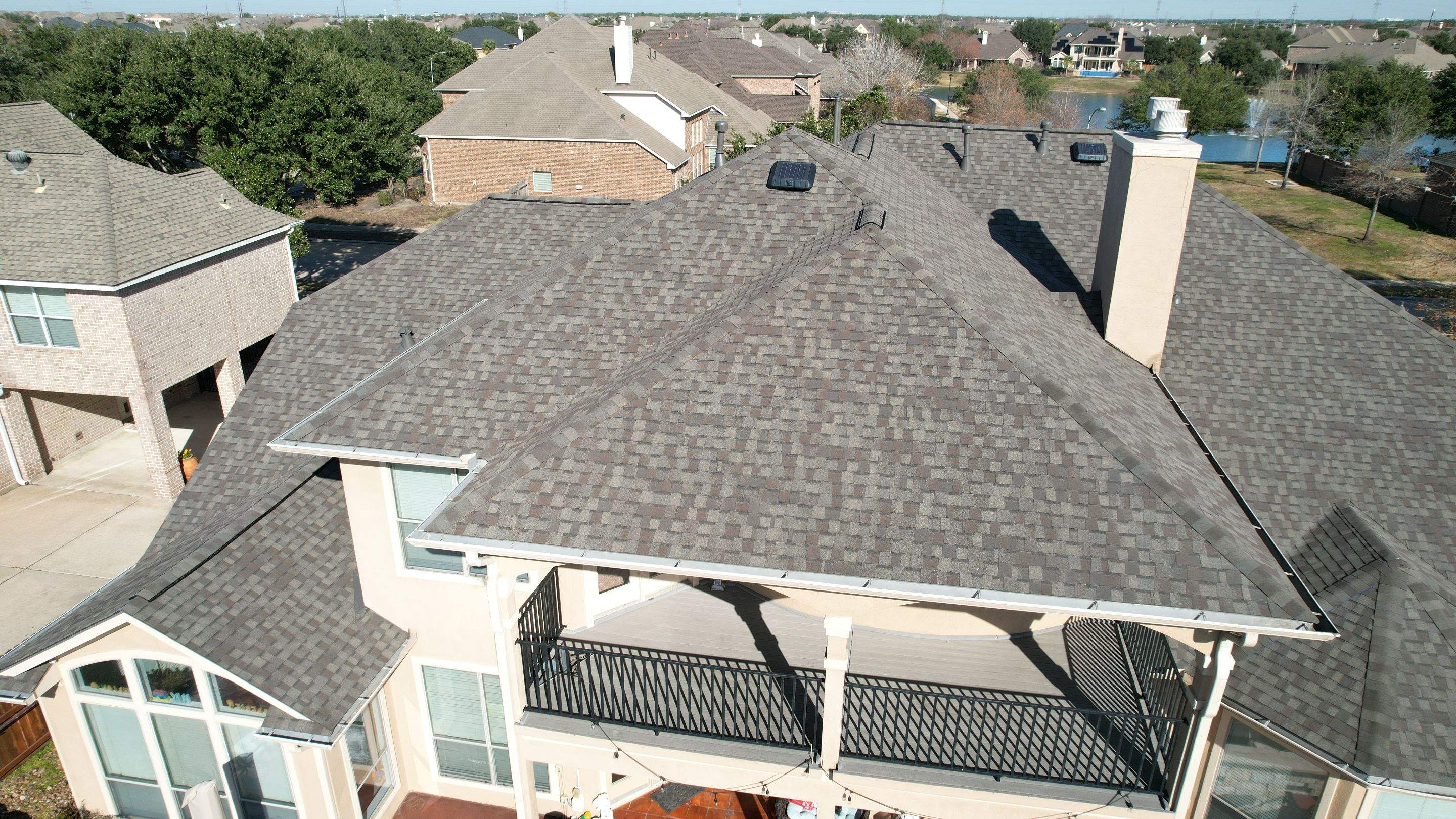 Two-Story Roof Replacement & Chimney Stucco Repair — Houston, TX by PL Roofing & SB Roofing, LLC.