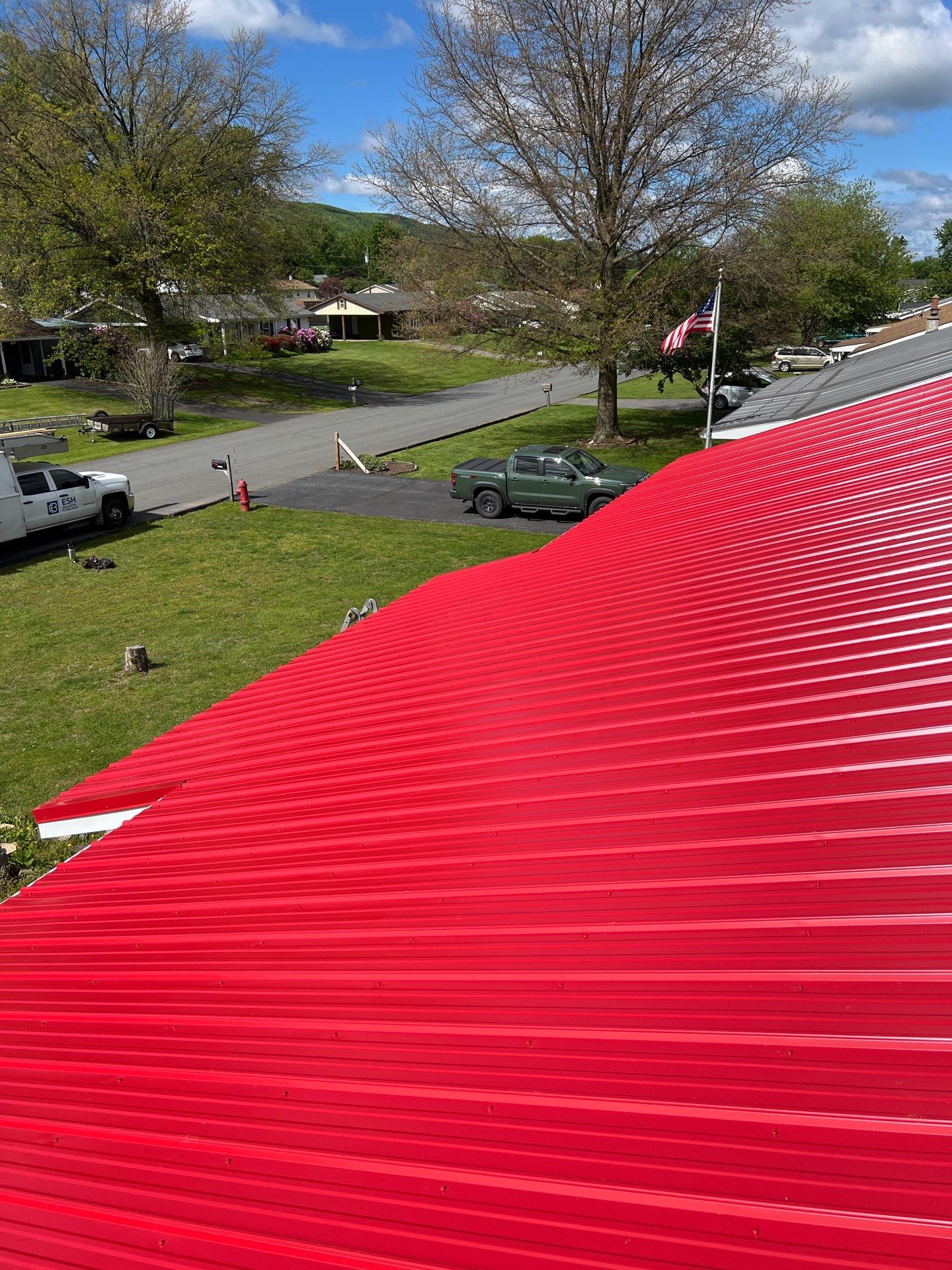 Red ABM Panel Metal Roofing Installation on Elizabethville Ranch Home by Esh Builders