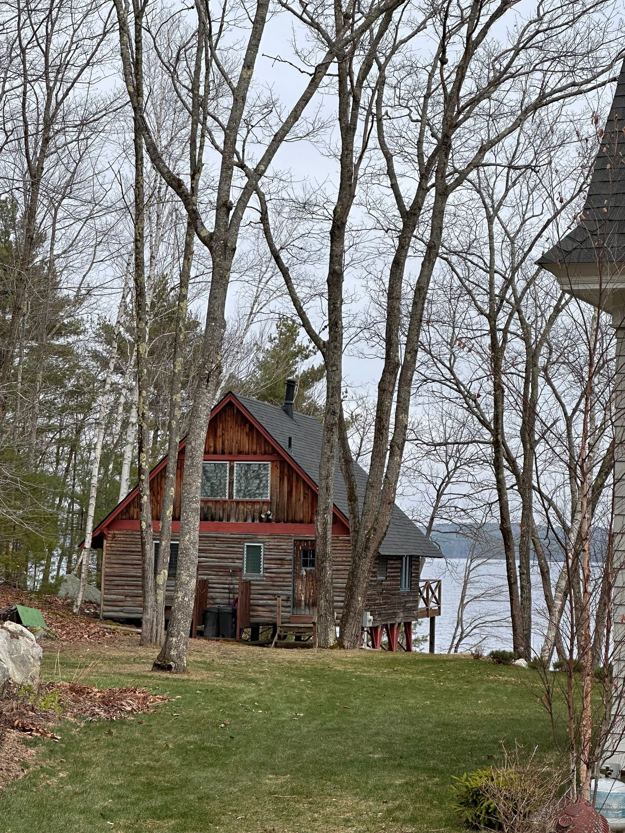 Asphalt Shingle Roof Replacement for Raymond Lakefront A-Frame Cabin by Tall pine roofing