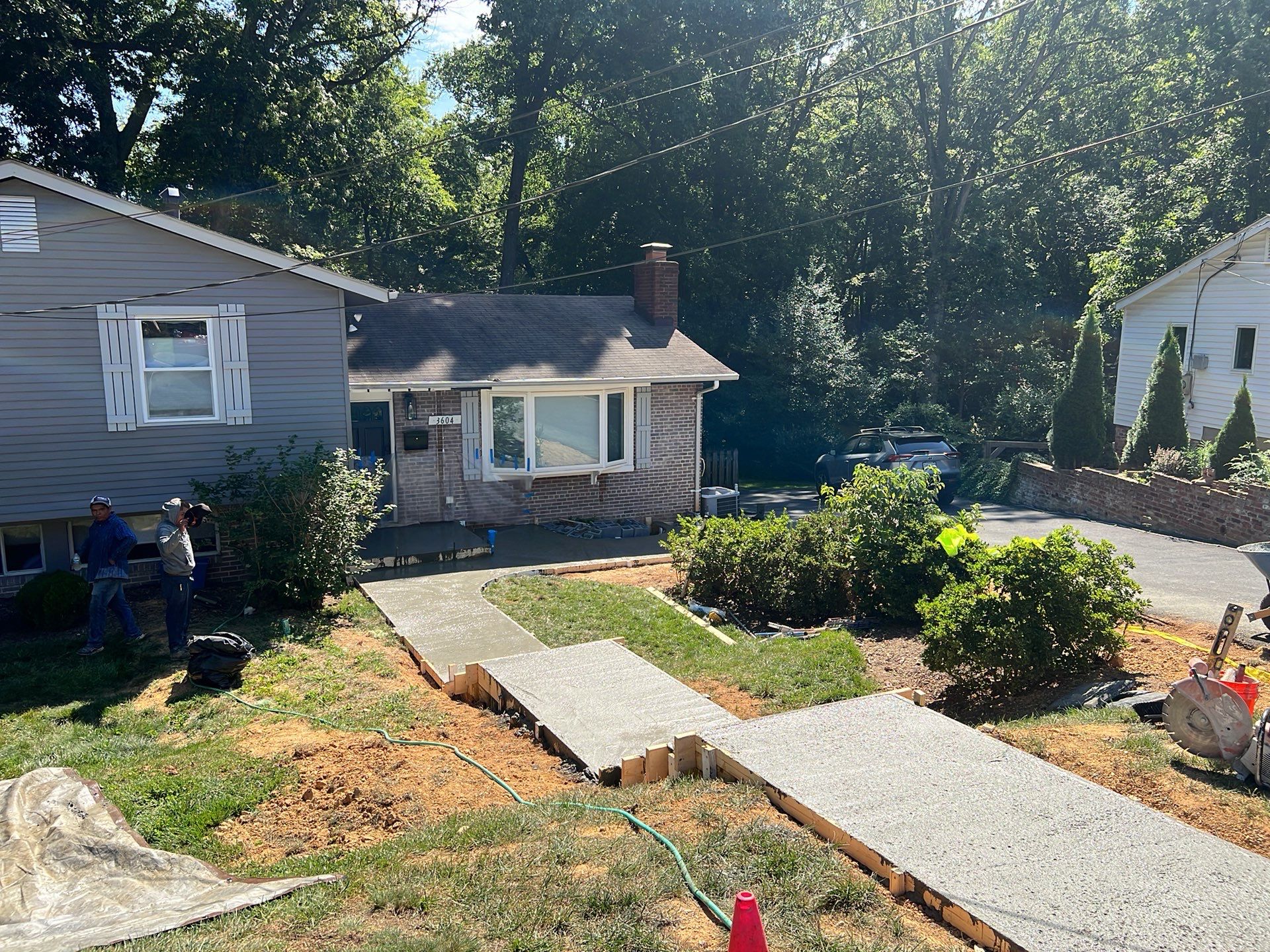 New walkway with stairs and a new front porch by Fairfax Contractors, LLC