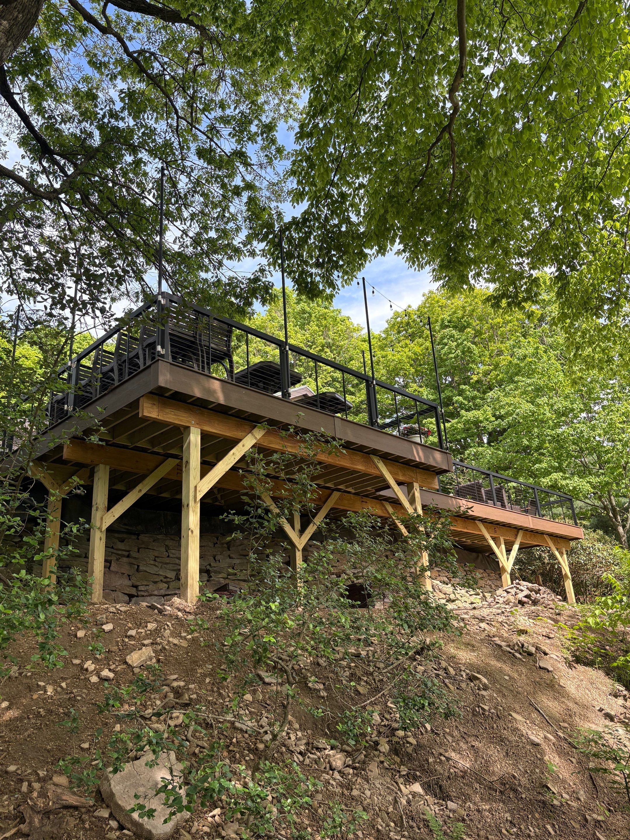 1500 sq/ft Composite Deck Build with Outdoor Kitchen in Champion by Cousins Roofing Siding & Decks