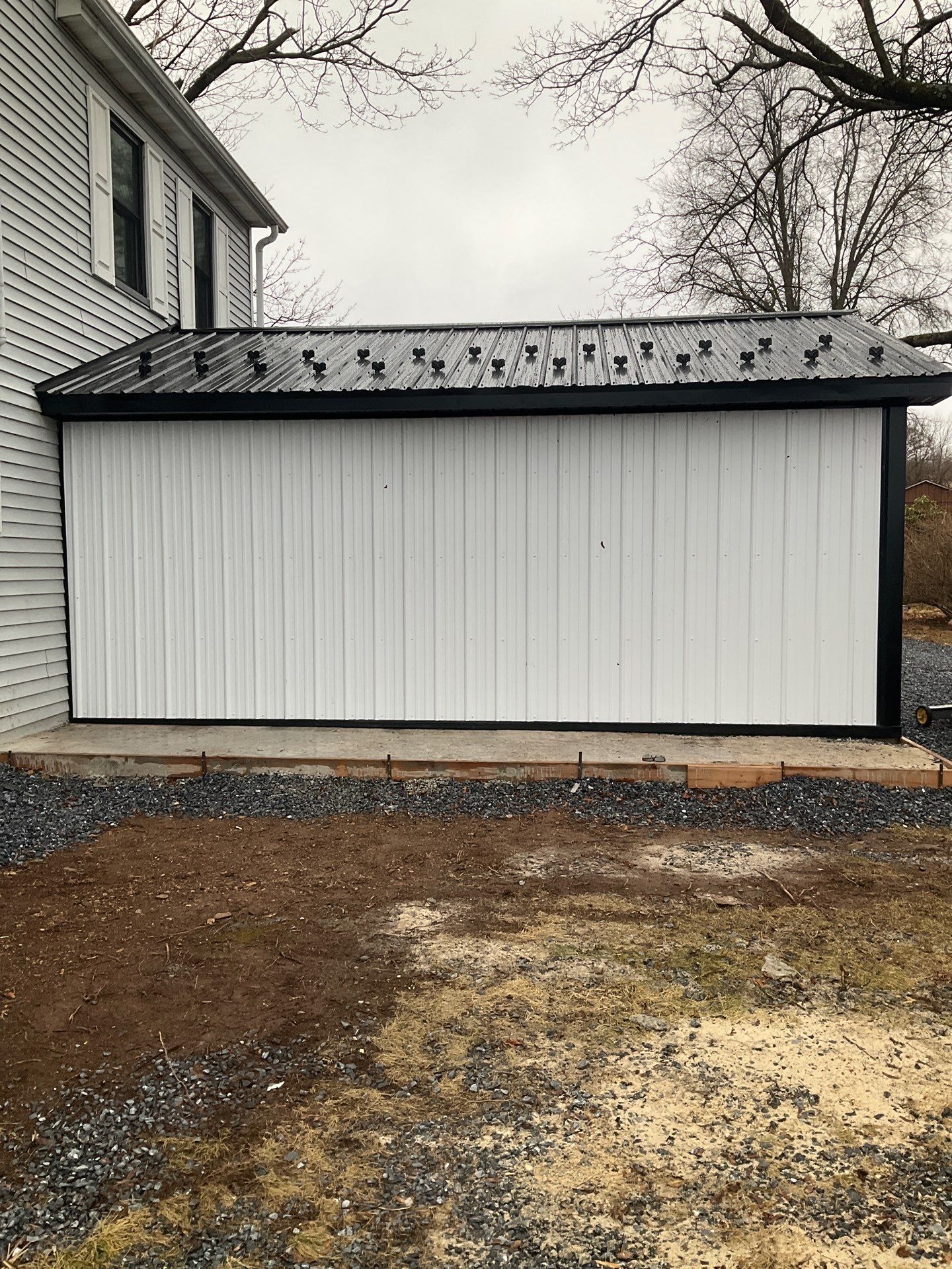 Carport Enclosure with Metal Siding and Roofing in Halifax by Esh Builders