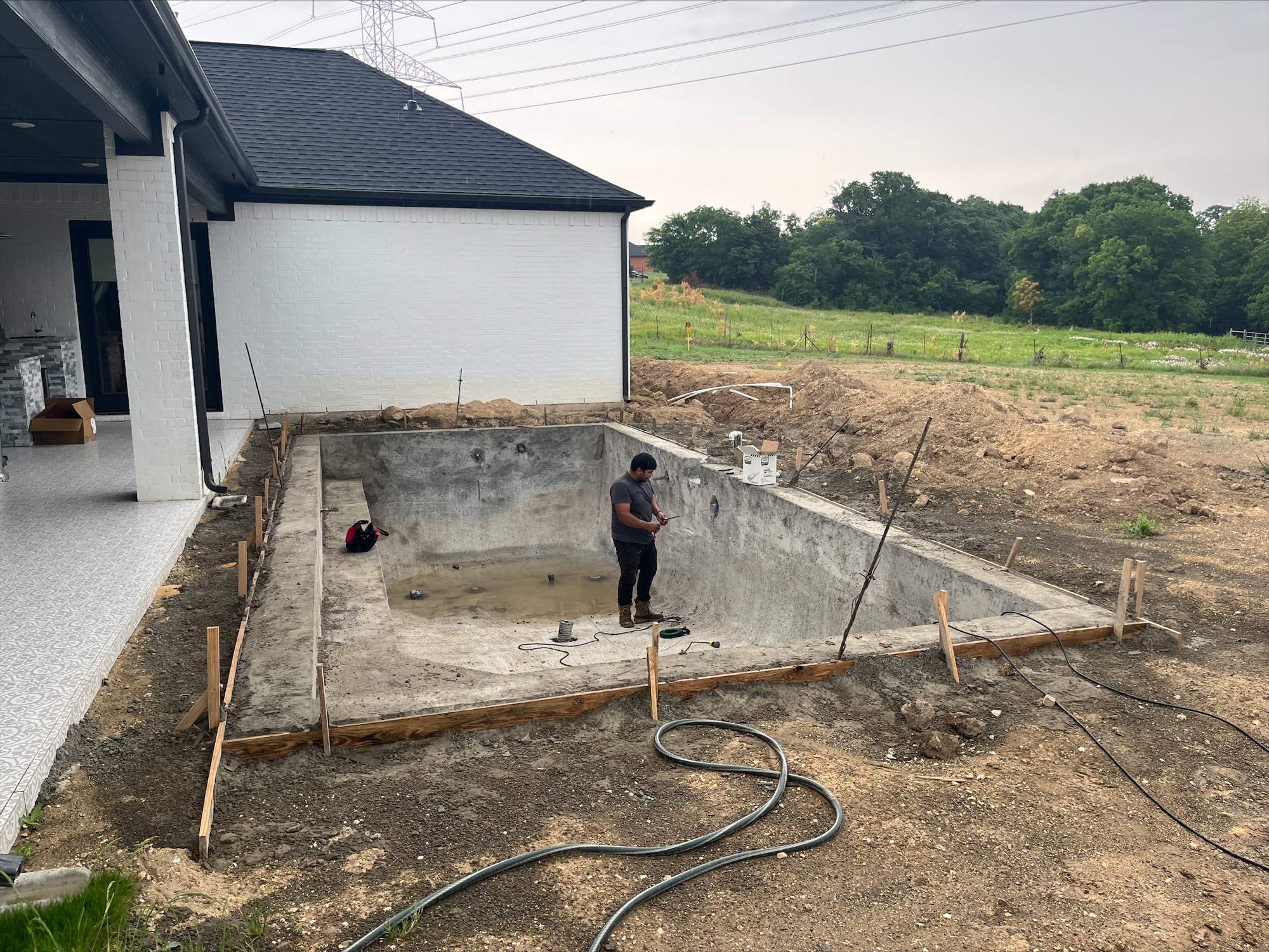 Geometric Pool with Tanning Ledge by Pinnacle Pools and Spas - DFW