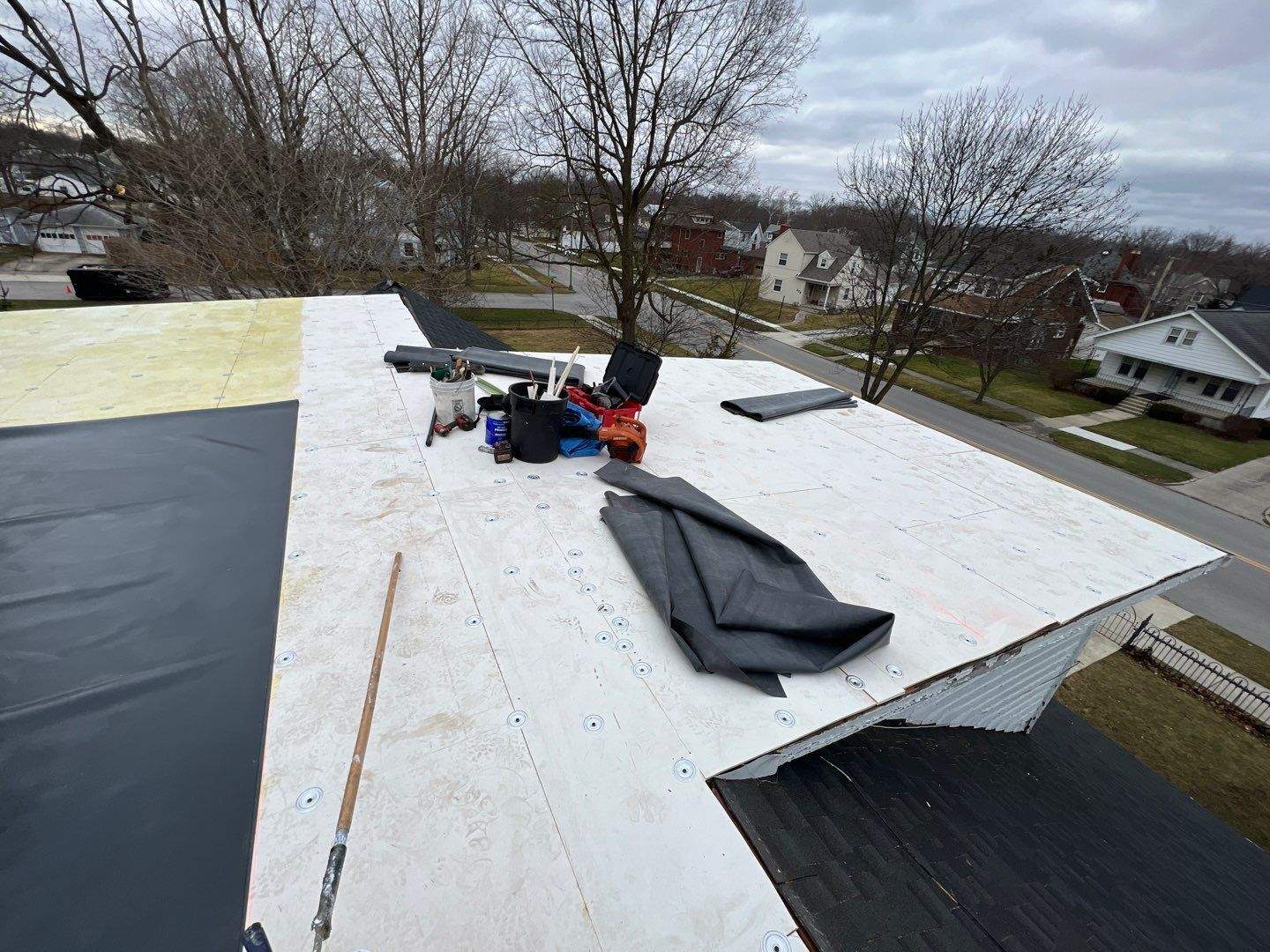 Residential Roofing Installation using 60 mil rubber roof by Nitro Roofing and Construction