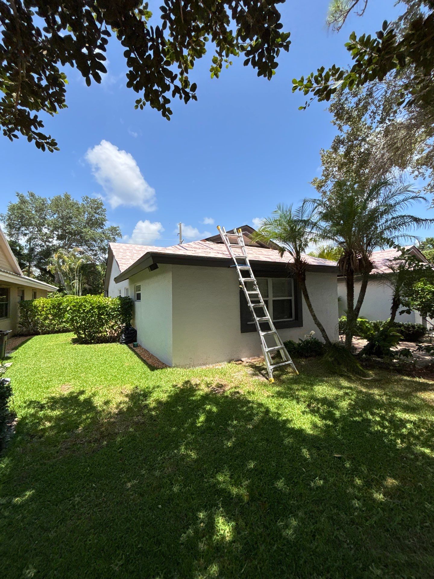 Standing Seam Metal Charcoal Grey Roof Replacement and Skylight Installation in Jupiter by Art's Roofing & Construction