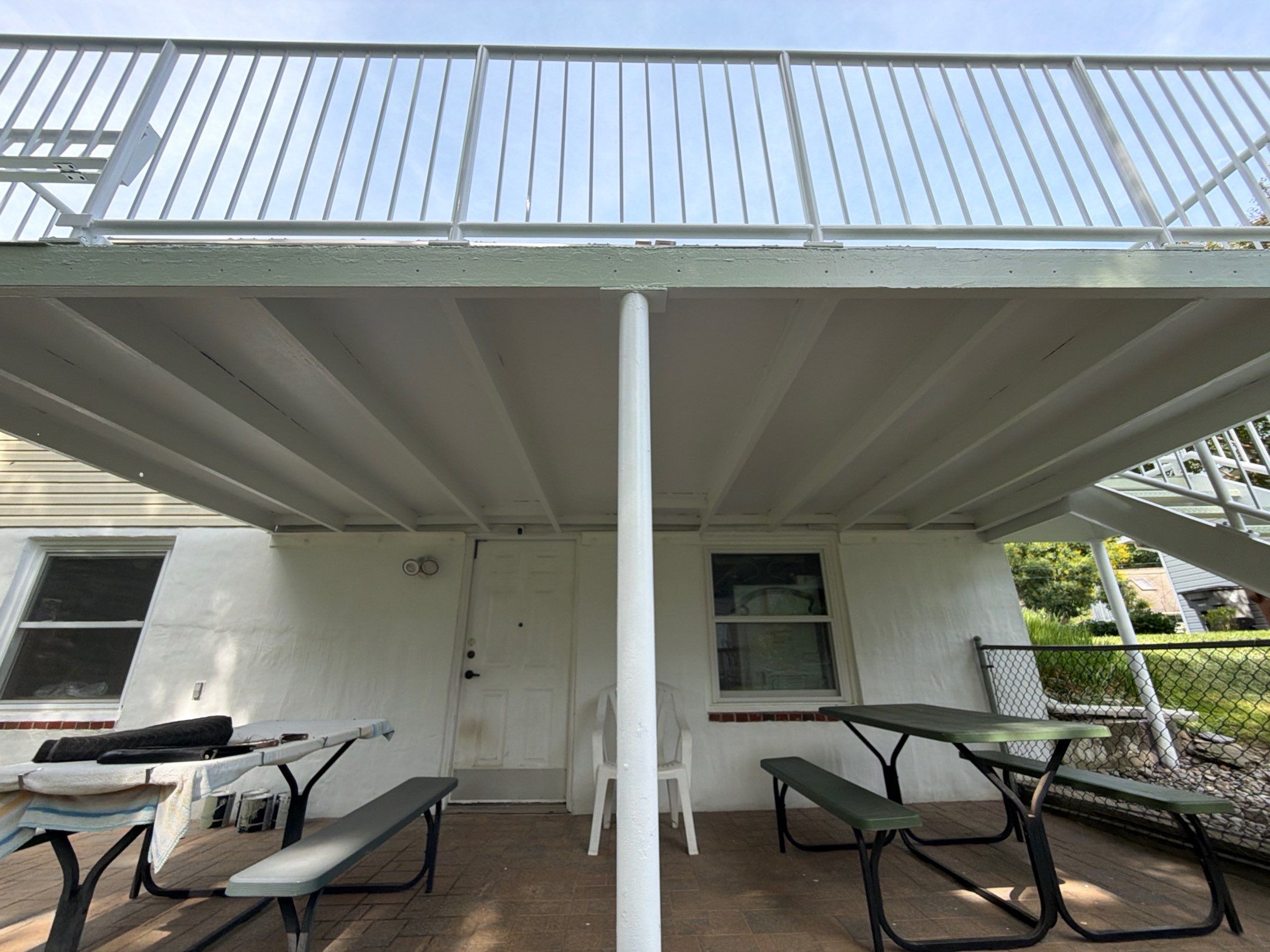 White Powder-Coated Outdoor Railings in Rockville & Staircase and Deck Refurbishment  by Capitol Iron Works