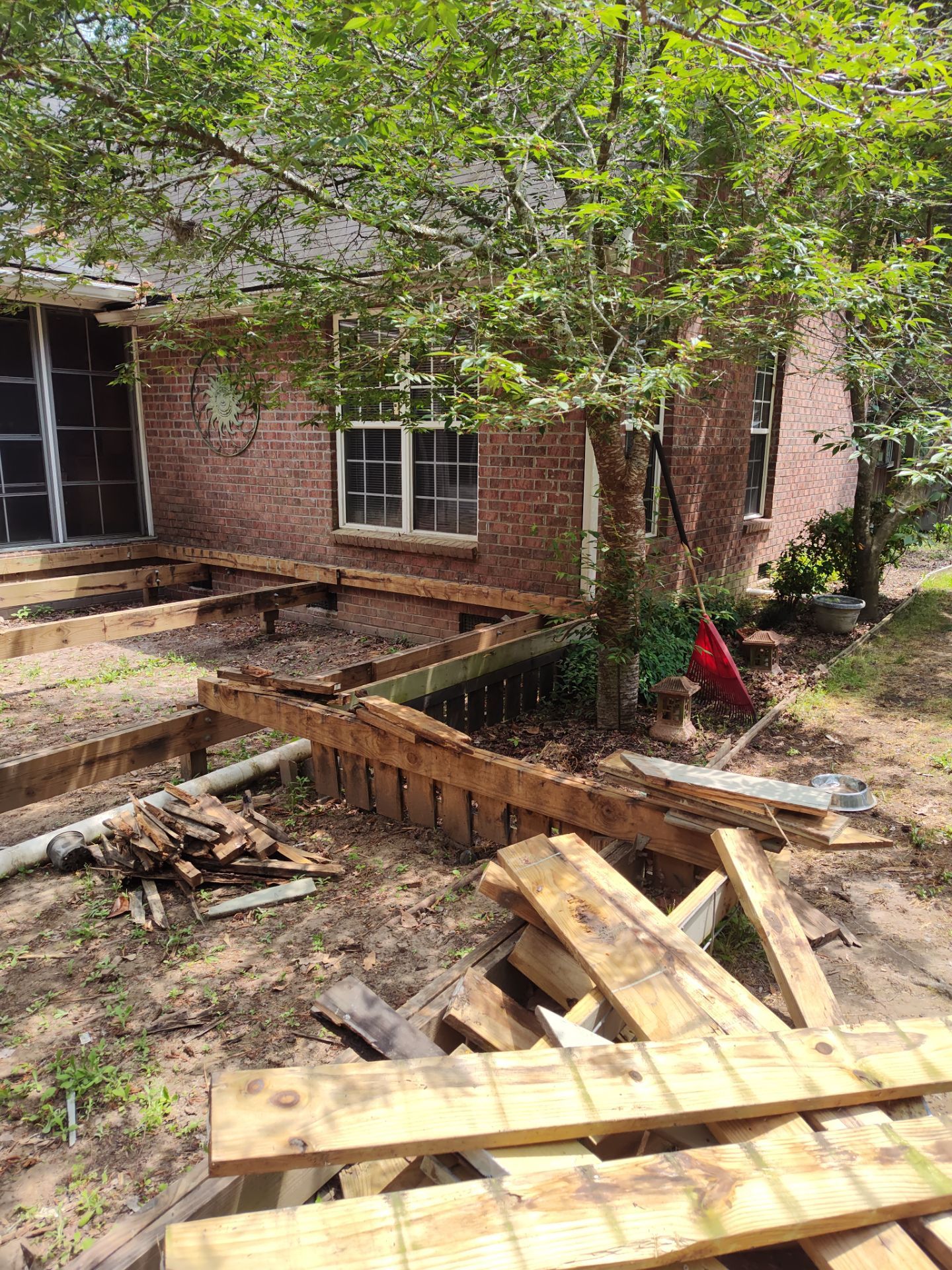 Patio in concrete with drainage improvements by Cornerstone Home Builders, LLC