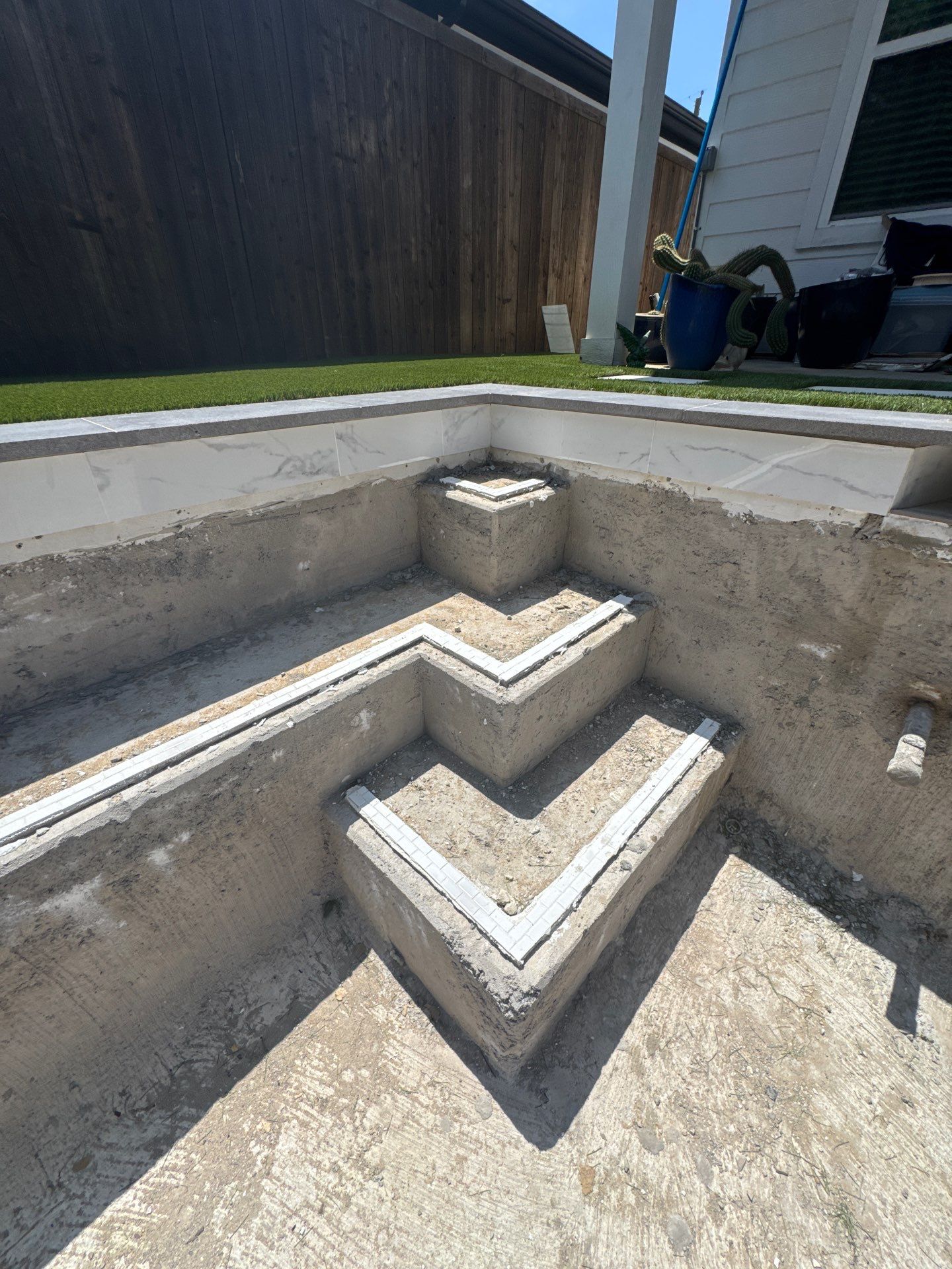 Modern Geometric Pool with Tanning Ledge and Turf by Pinnacle Pools and Spas - DFW