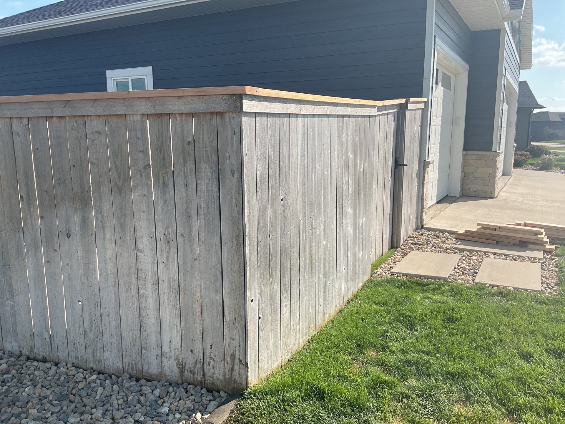 Custom Privacy Fence and Paver Patio Installation in Sioux Falls by Select Painting, Coatings & Garage Cabinets