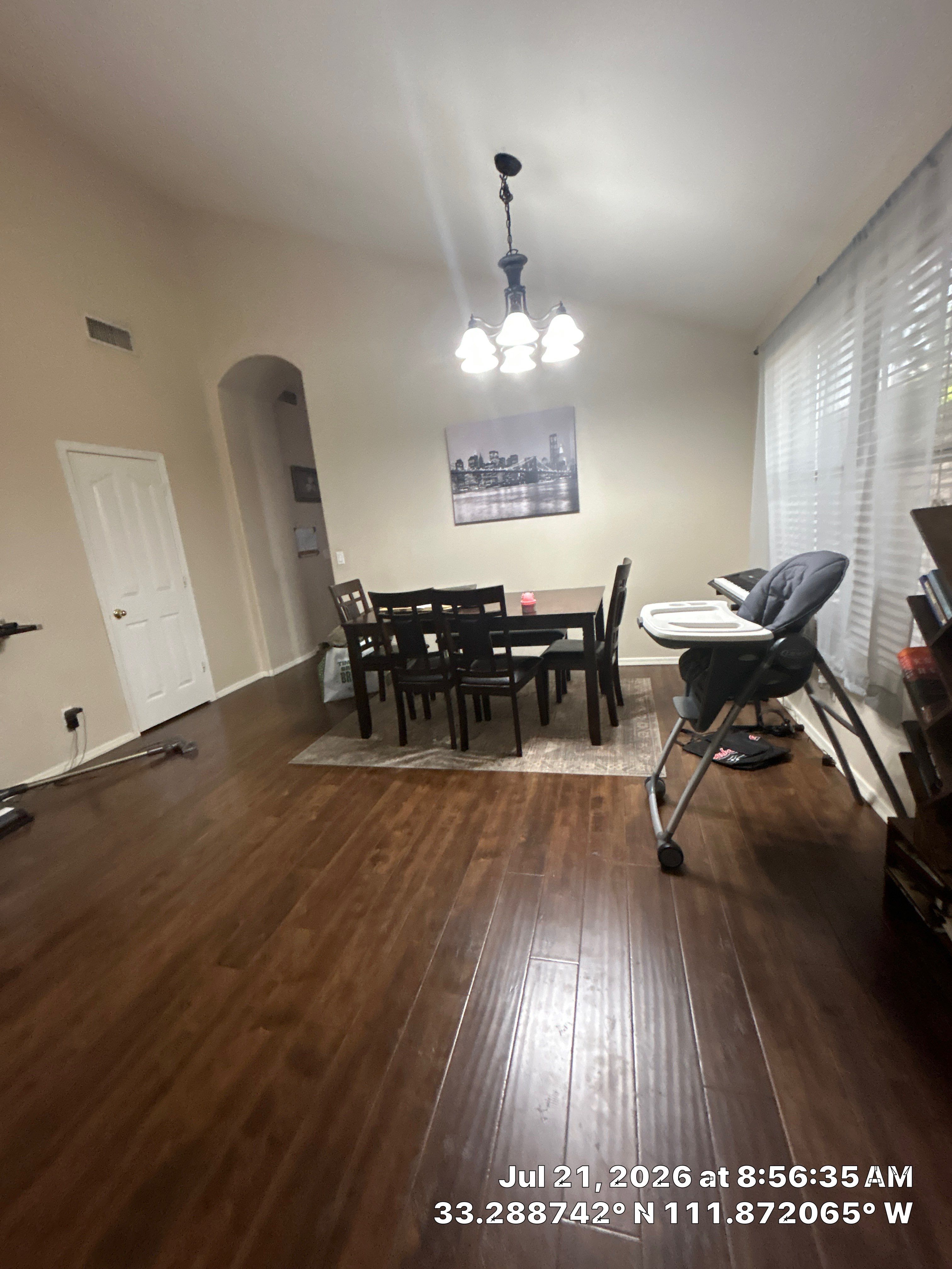 Dark Wood Laminate Flooring Installation in Chandler Dining Room by CompanyCam Sales Demo