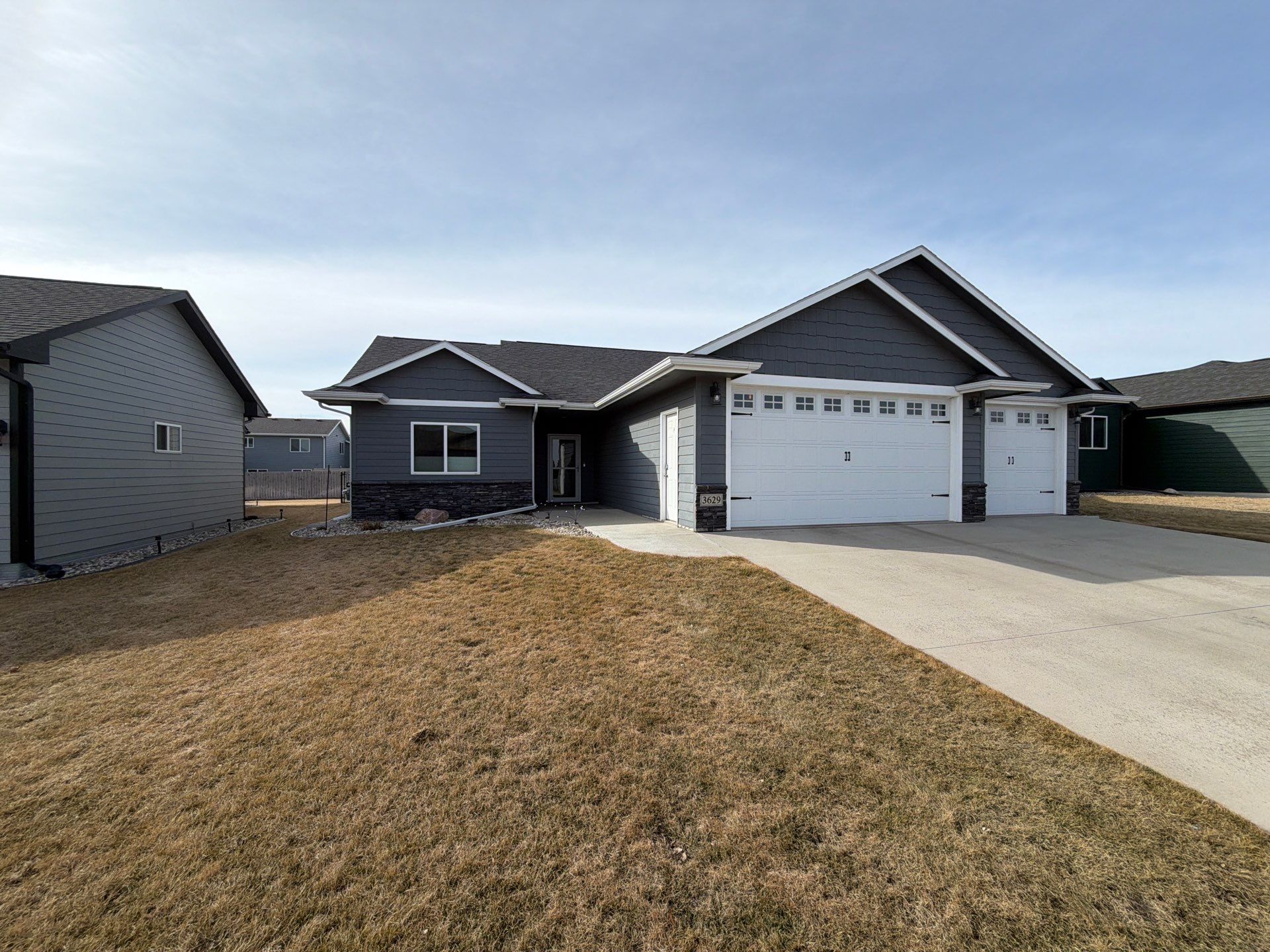 Residential Exterior Painting and Siding Refresh in Sioux Falls by Select Painting, Coatings & Garage Cabinets