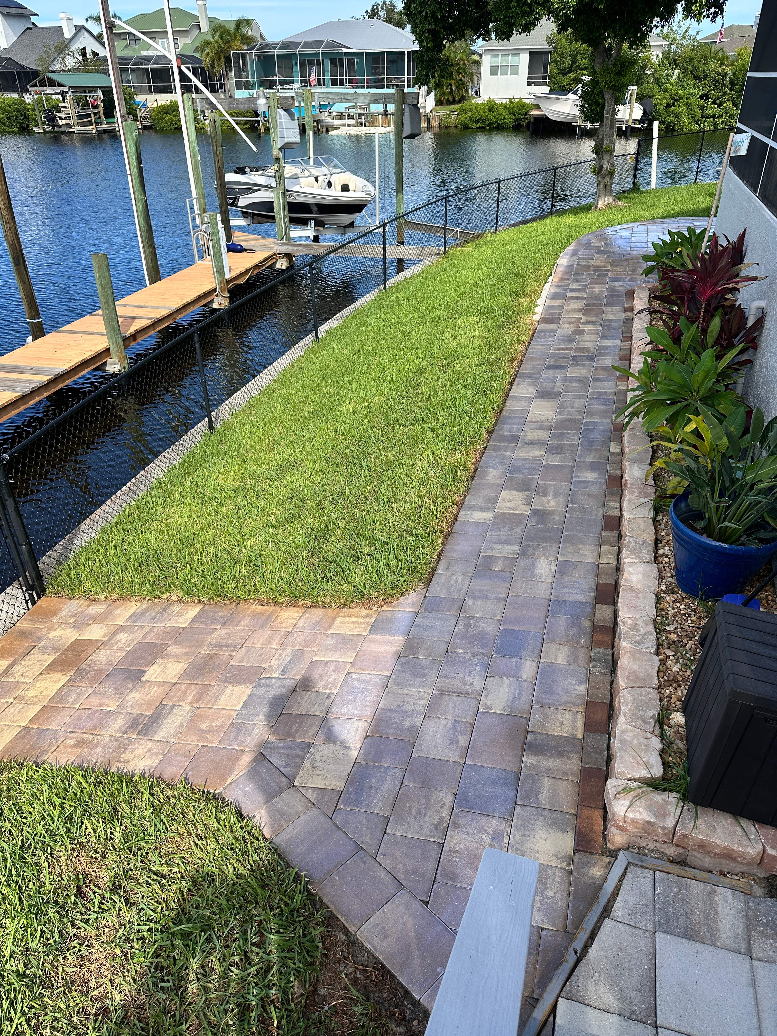 Travertine Sealing and Stripping for a Waterfront Pool Deck in Apollo Beach by Supreme Paver Experts