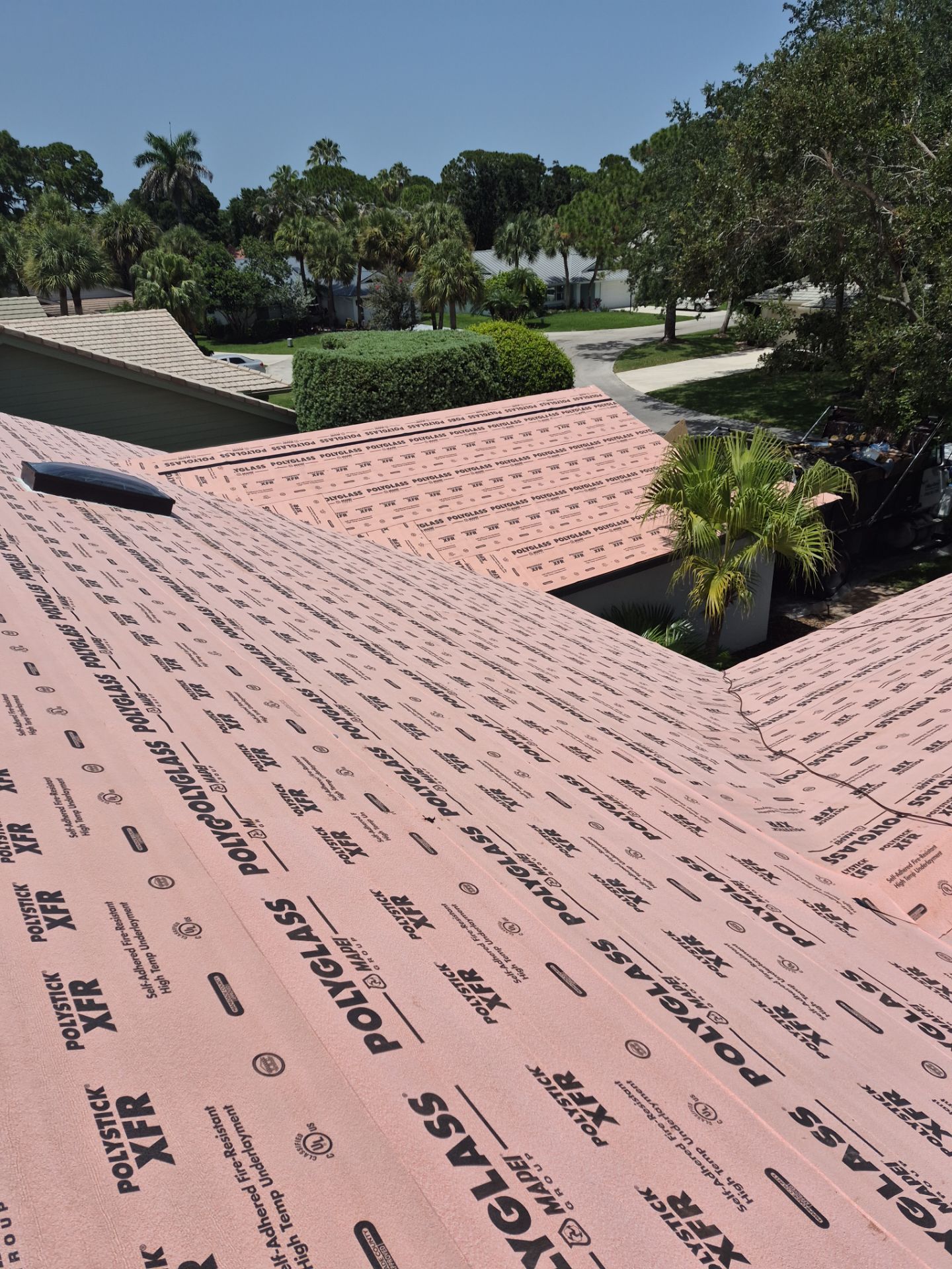 Standing Seam Metal Charcoal Grey Roof Replacement and Skylight Installation in Jupiter by Art's Roofing & Construction