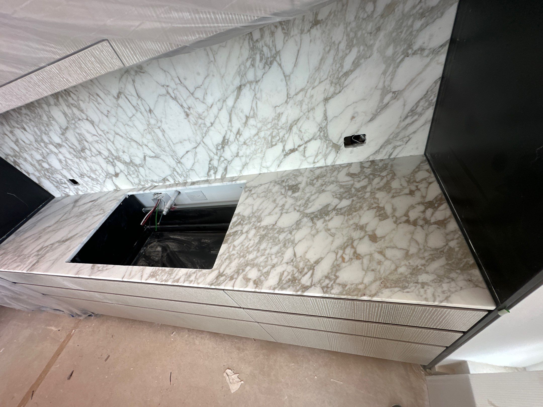 Kitchen Countertop with backsplash and Island top with mitered waterfalls by NC Stone And Tiles
