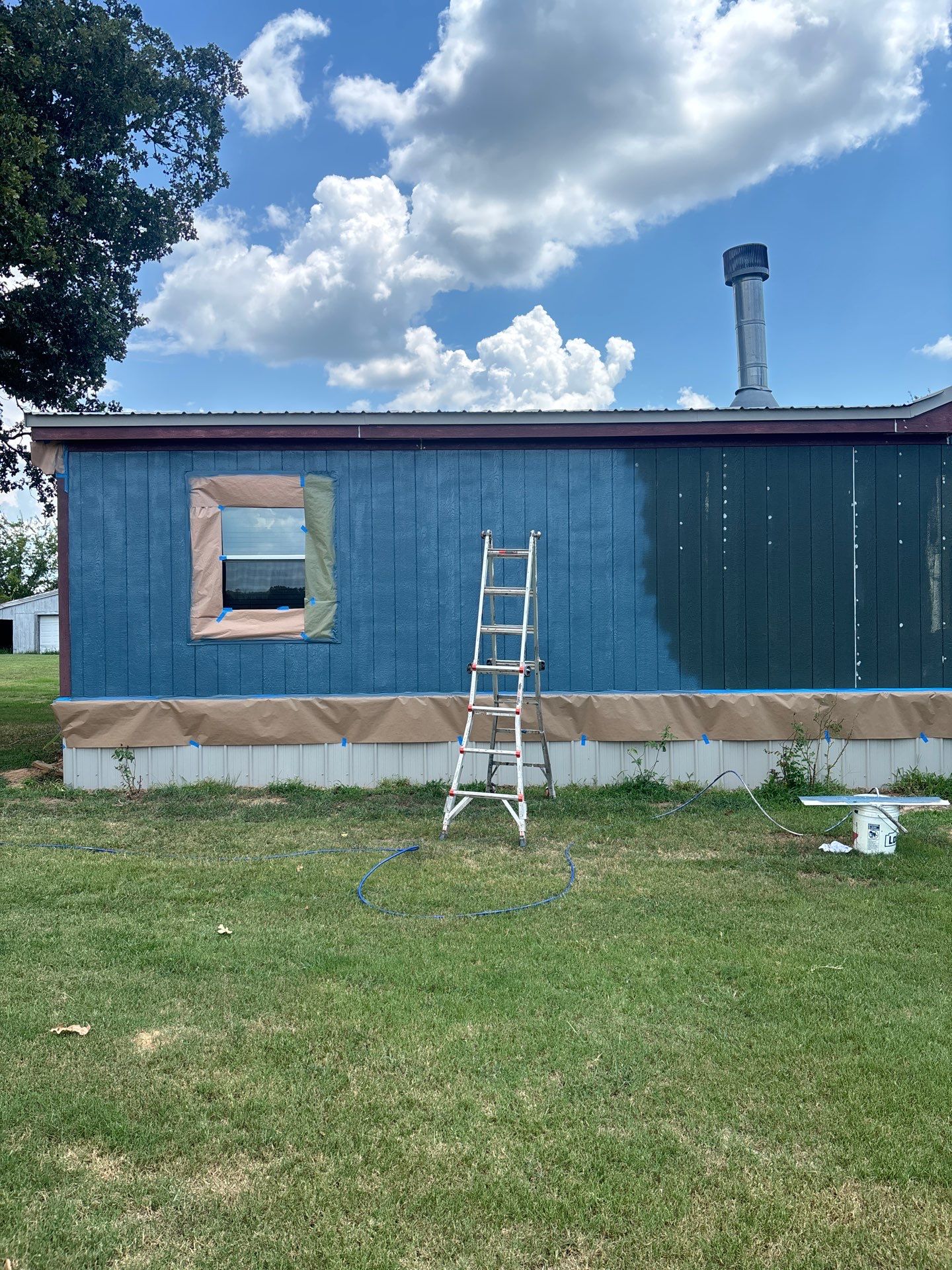 Exterior Painting in Fruitvale, TX | Wood Porch & Home in Deep Navy Blue by Quality Coats Painting
