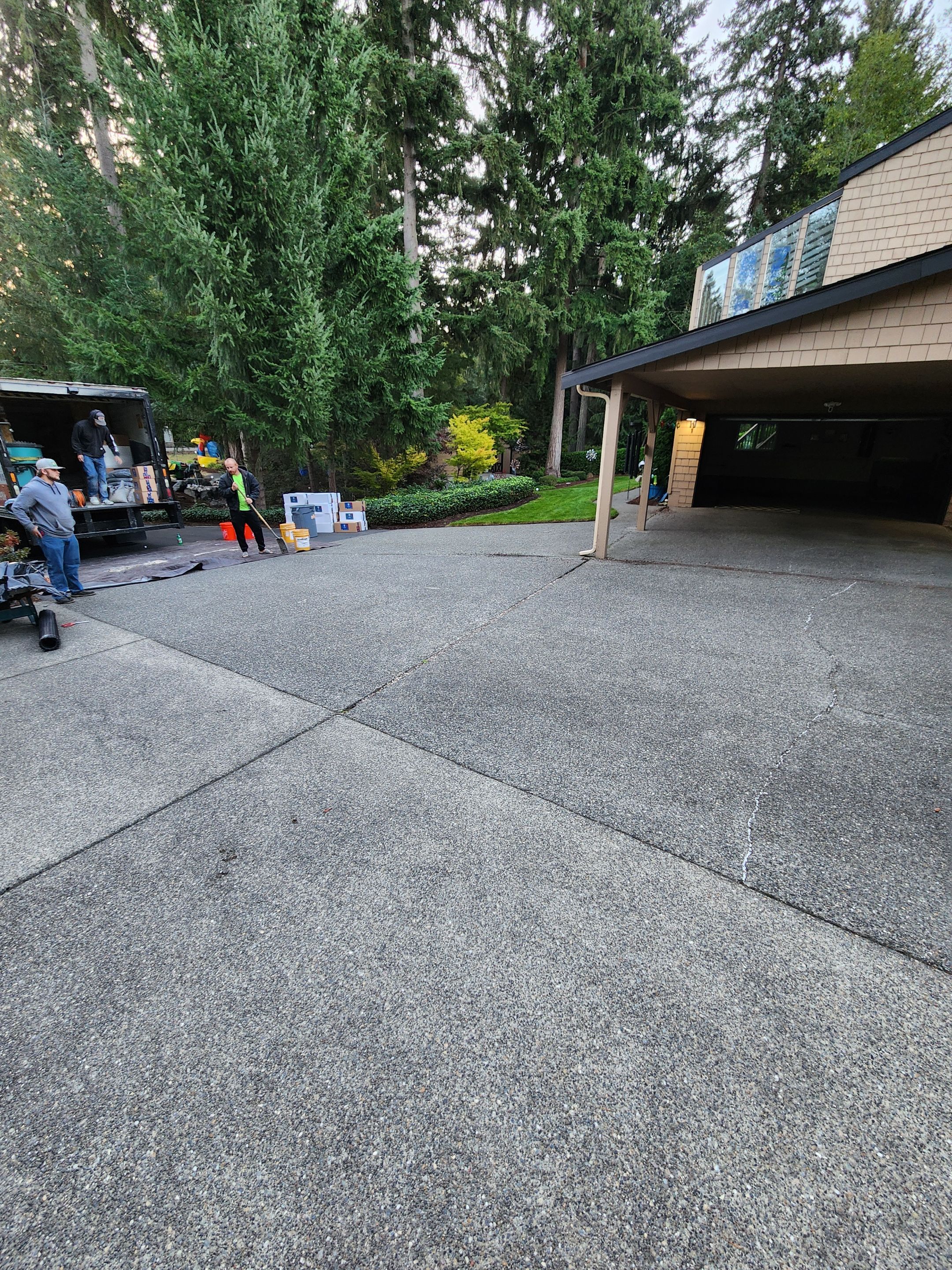Walkway and driveway by Concrete Coating Experts Inc.