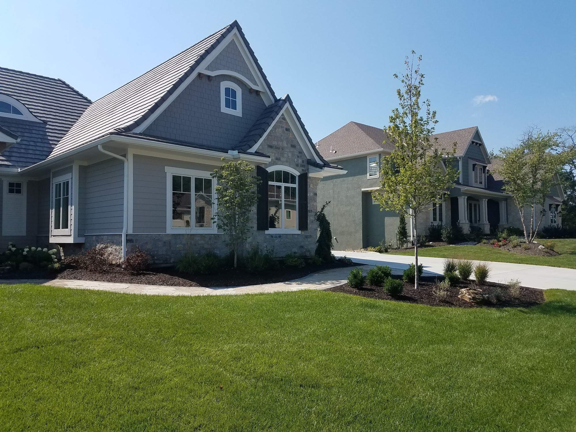 Front Yard Landscape and Walkway Renovation in Overland Park by LAND ESCAPES LLC