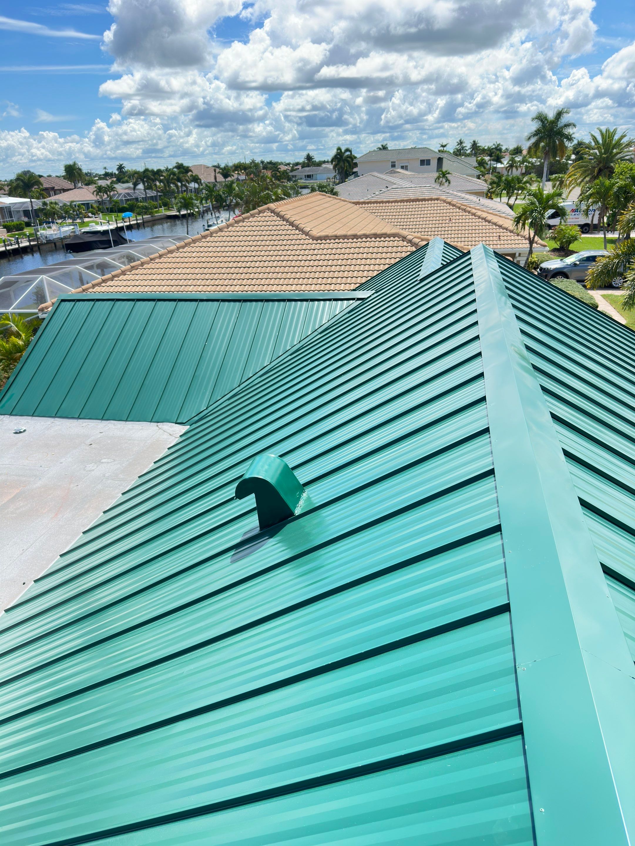 Residential Roofing Installation using Gulf Coast Metals Gulf Seam Panels by Four Peaks Roofing