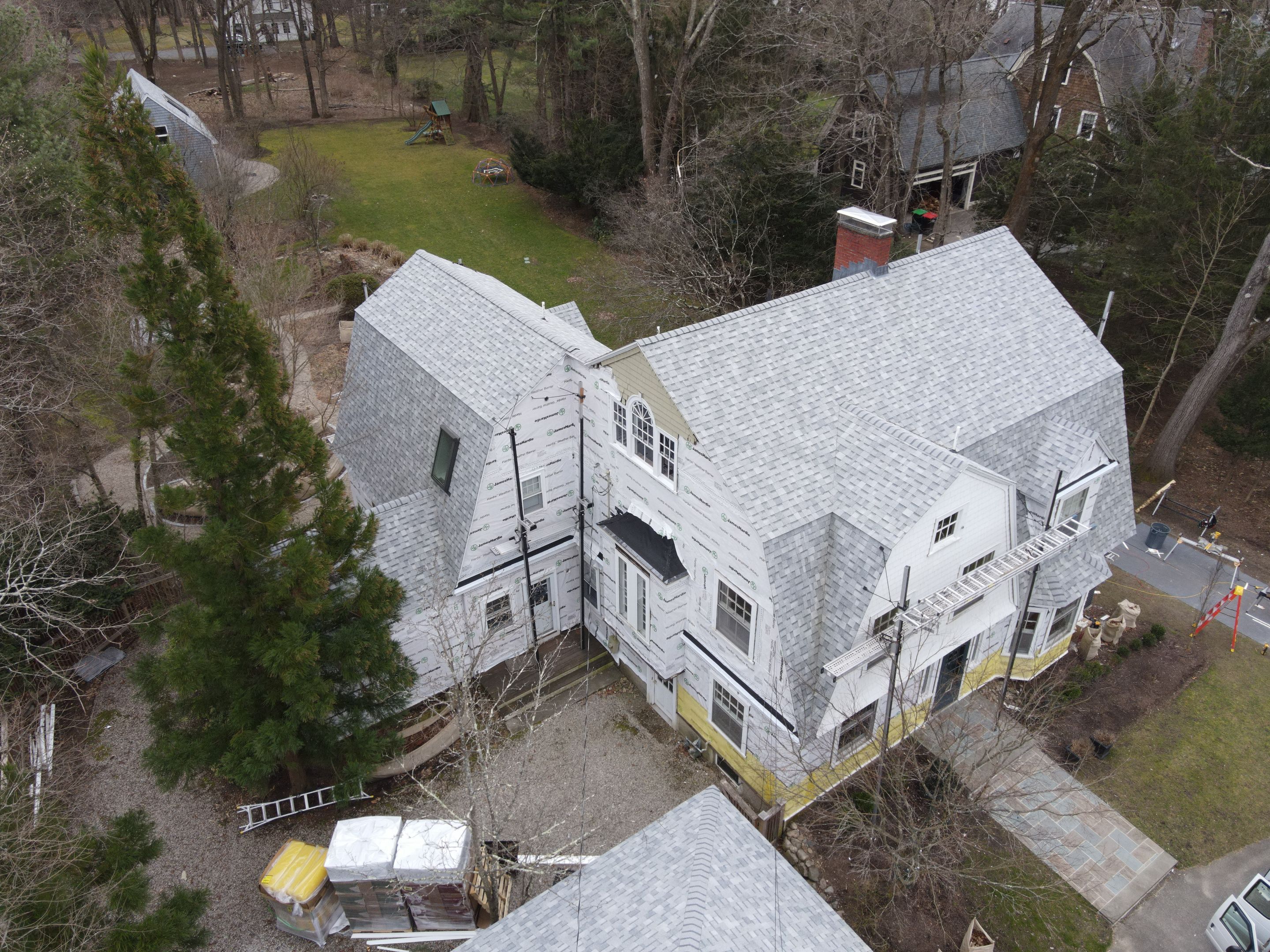 White cedar shingles and windows in Wayland, MA by UBrothers Construction