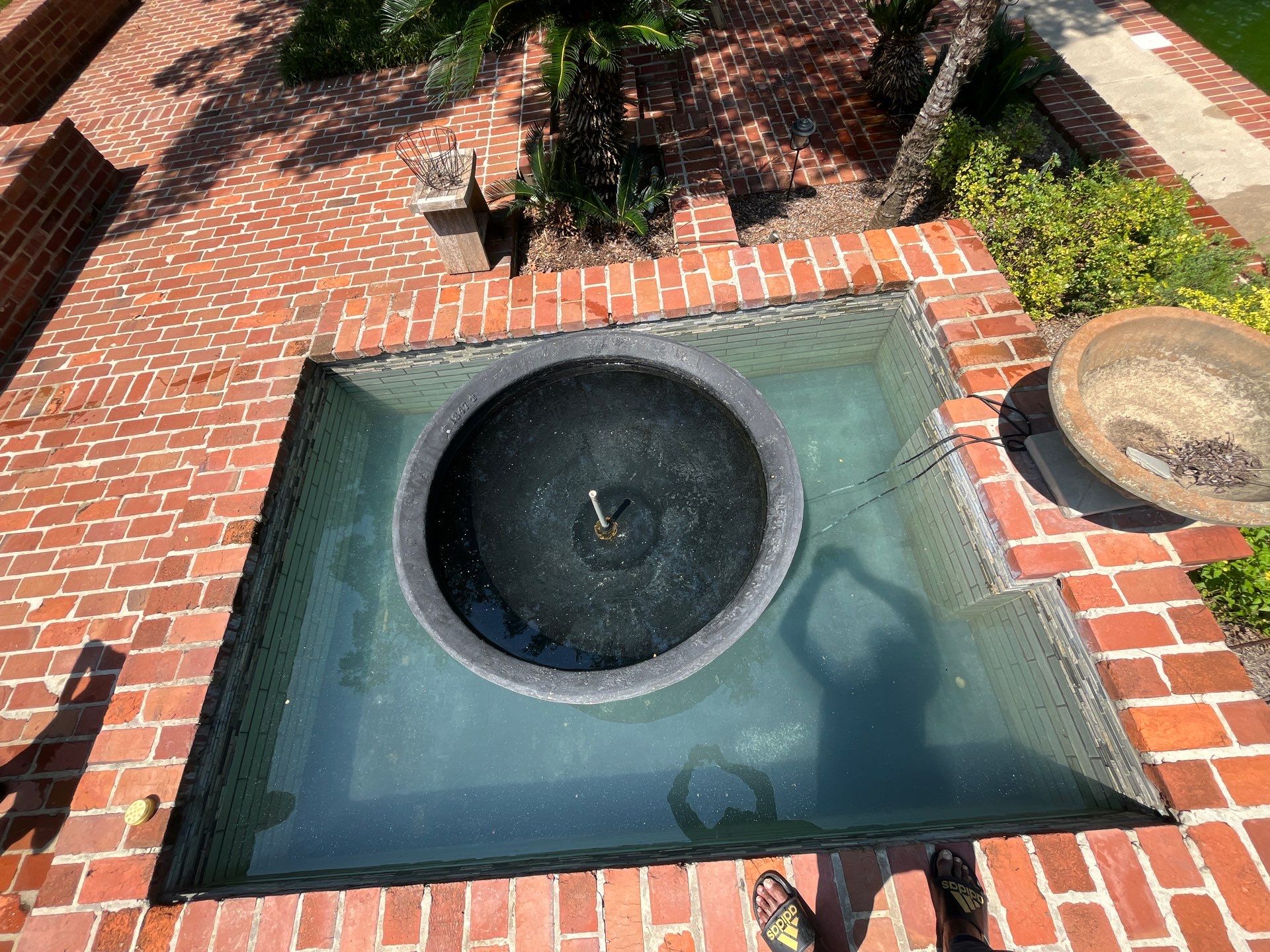 Pool Cleaning using Pool Cleaner by College Bros Outdoor services