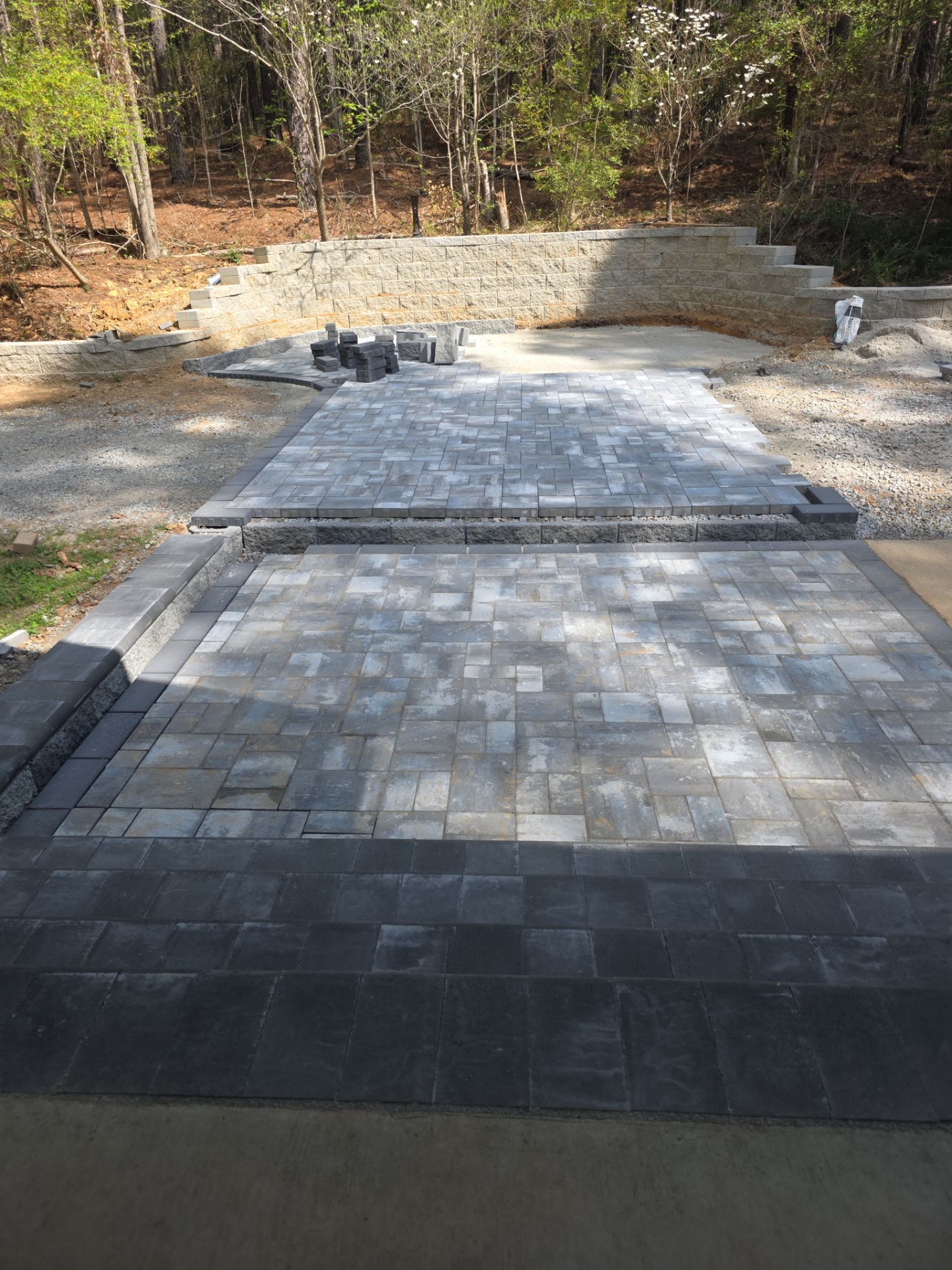 Pittsboro Outdoor Living Transformation – Retaining Wall, Paver Patio & Elevated Deck by Elite Remodeling and Design LLC