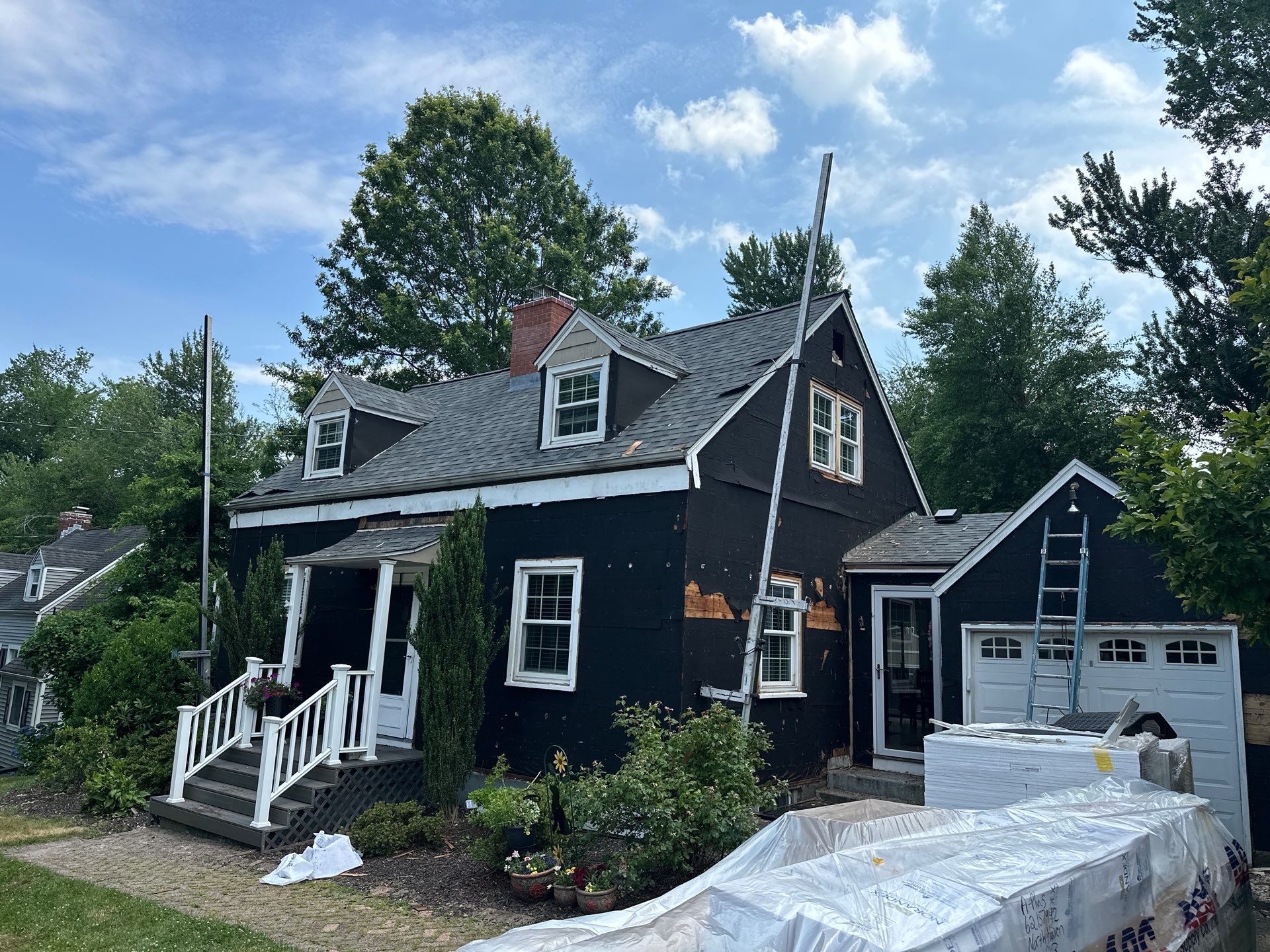 Complete Exterior Estate gray with Pacific Blue Siding by A Plus Exterior