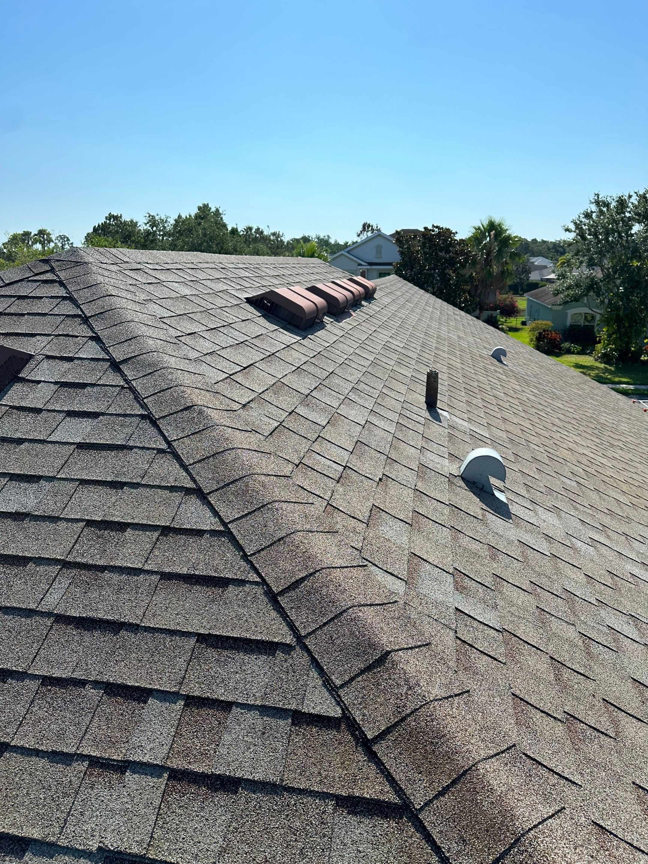 Asphalt Shingle Roof Soft Wash Cleaning & Concrete Pressure Washing in CopperStone Community, Parrish, FL by Sunshine AquaWash